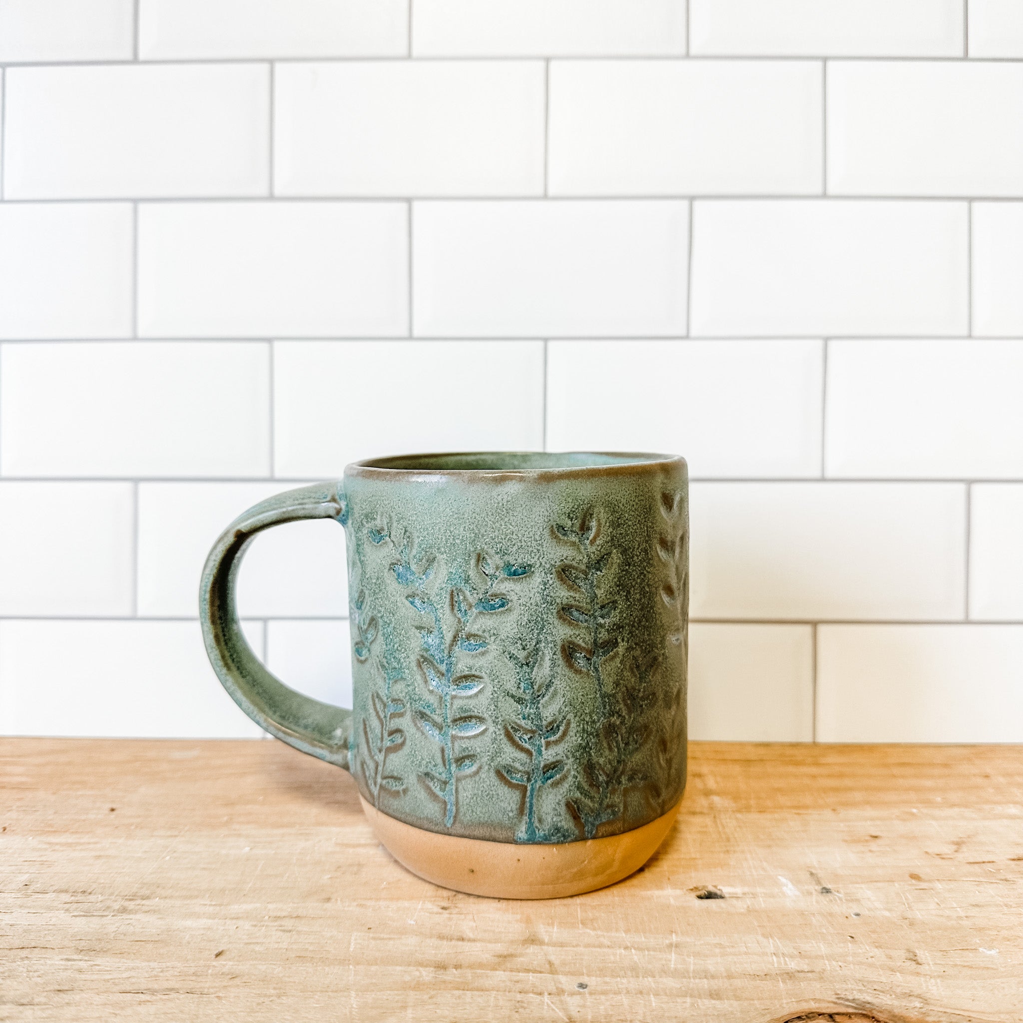 Debossed Stoneware Mug, Reactive Glaze