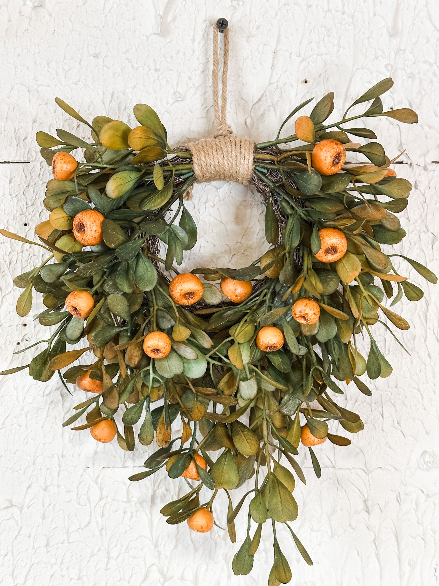 10 inch round rustic olive leaf and orange pod wreath at the rustic barn in killinworth ct
