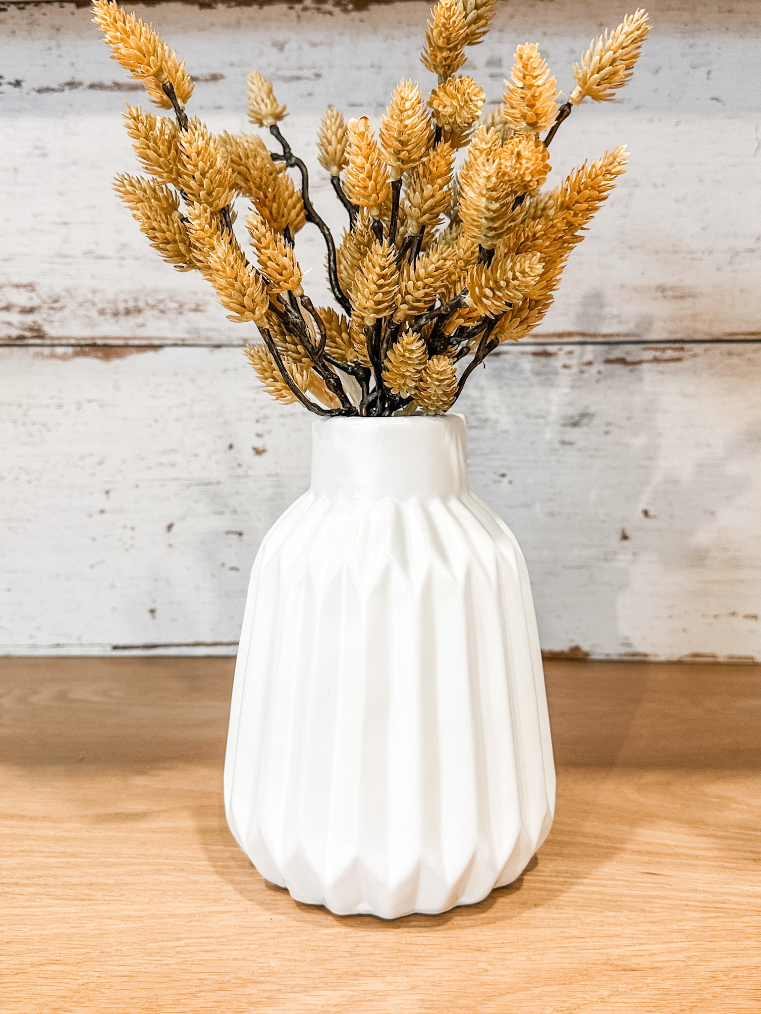 faux dried golden pine cone fall stems at the rustic barn in killingworth ct