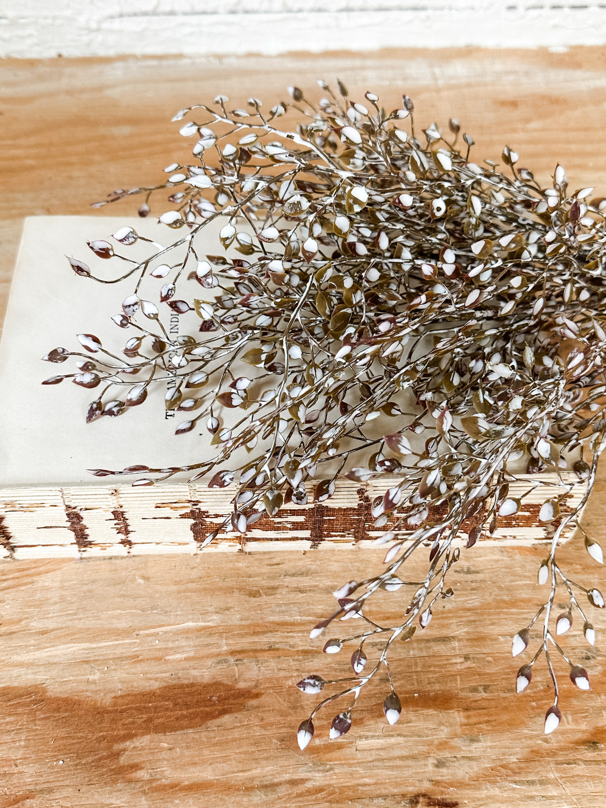 brown and white small leaves fall and winter faux stem at the rustic barn in killingworth ct