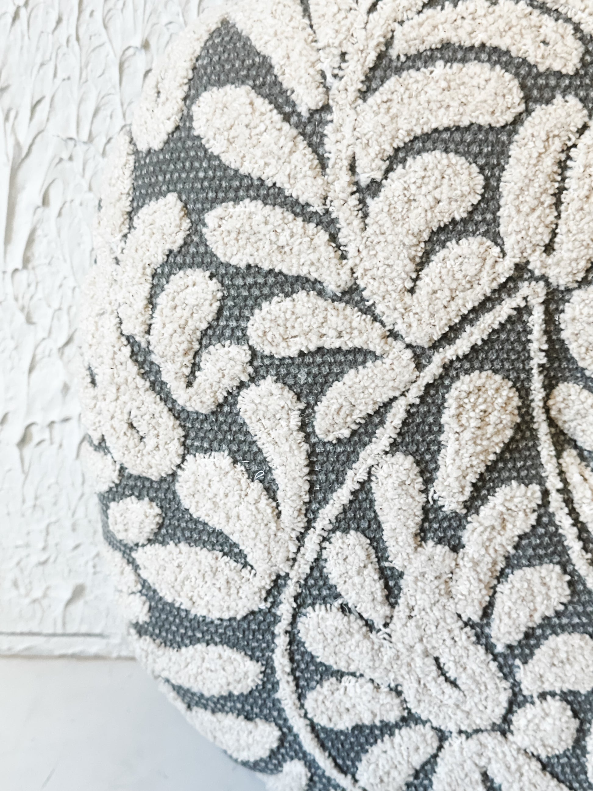 16" Wildflower Grey Hand-Embroidered Round Decorative Pillow at the Rustic Barn in Killingworth, CT