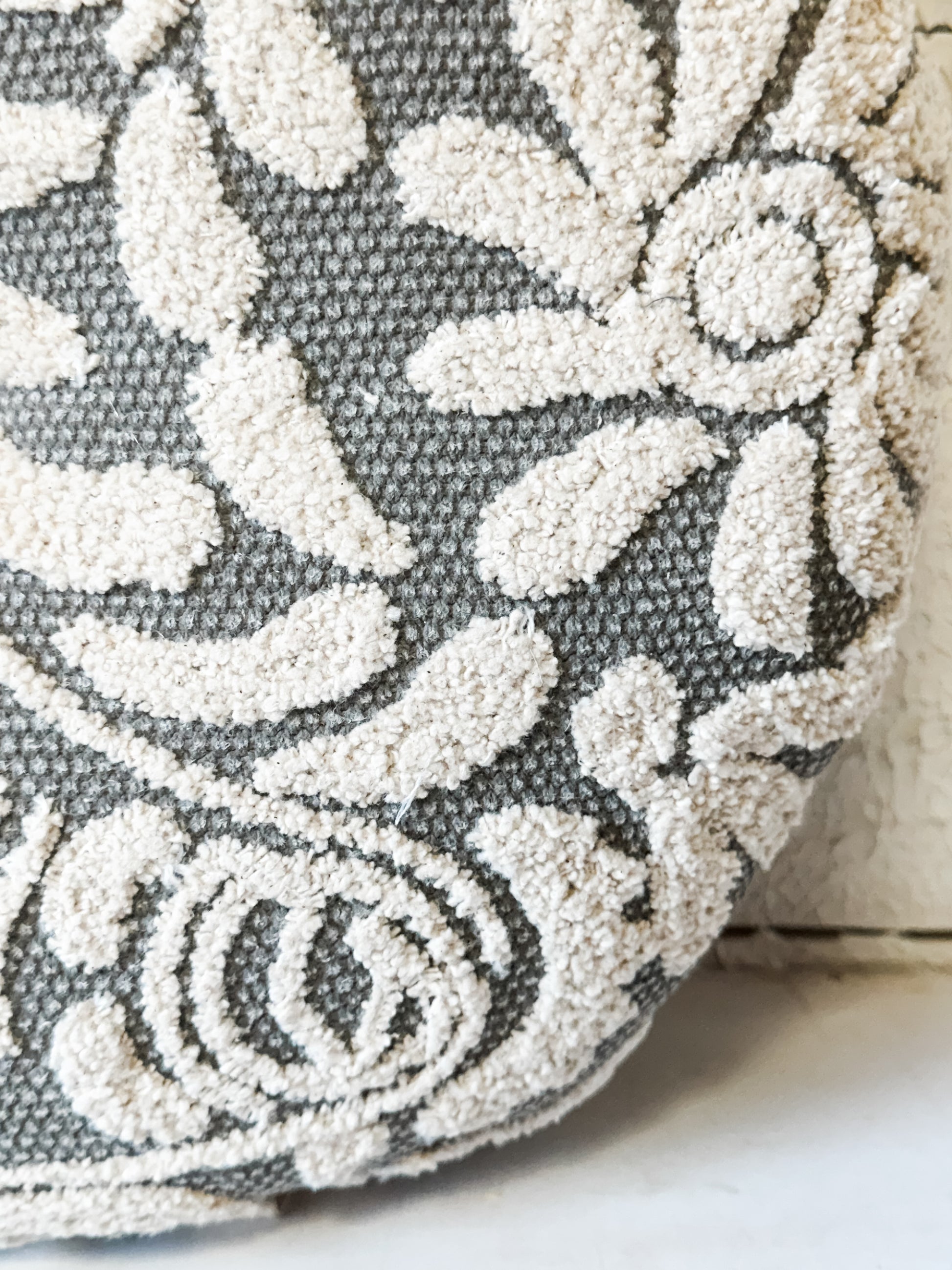 16" Wildflower Grey Hand-Embroidered Round Decorative Pillow at the Rustic Barn in Killingworth, CT