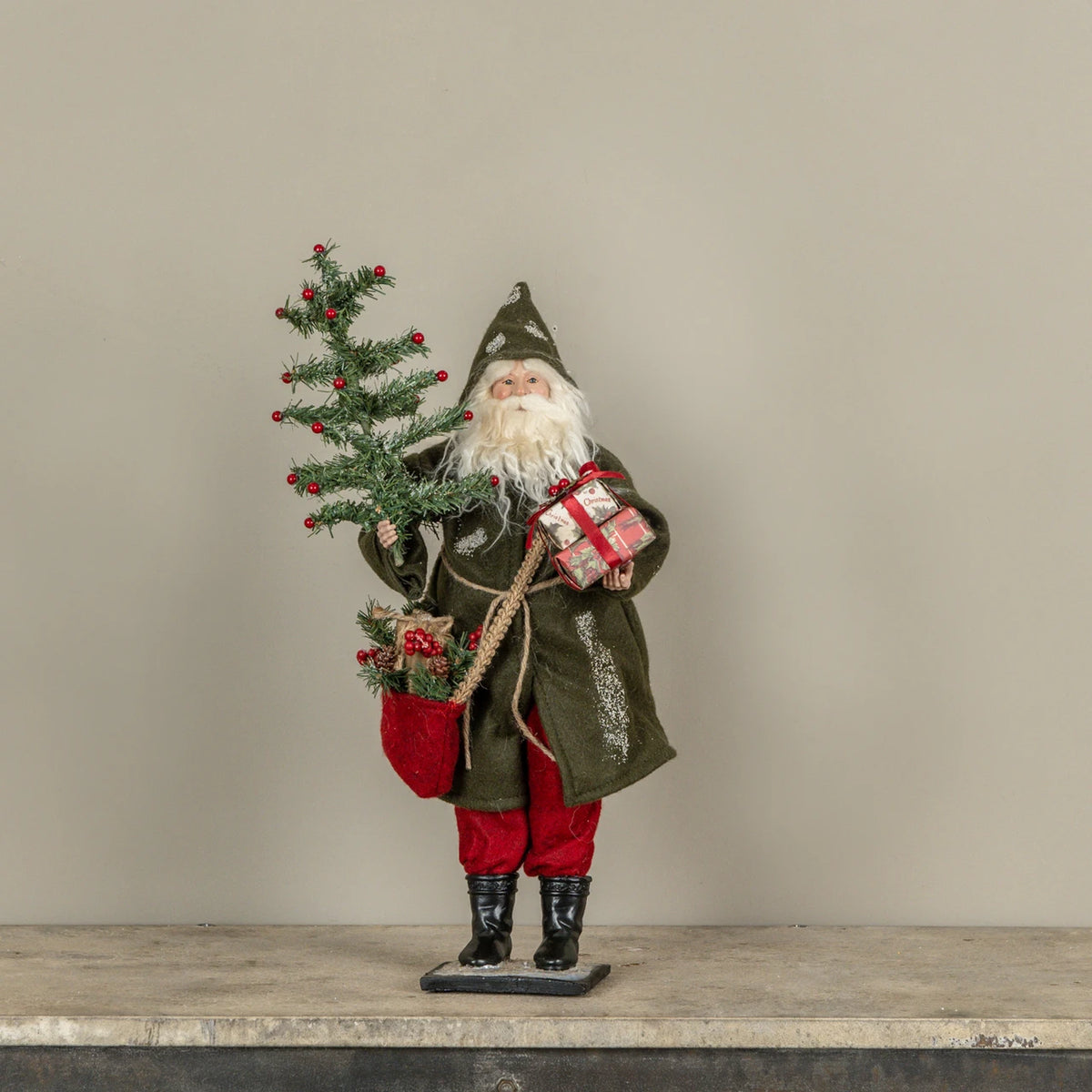 22 inch high santa holding gifts and feather tree at the rustic barn in killingworth ct