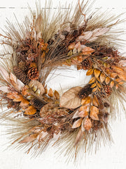 autumn pine cone and bay leaf wreath at the rustic barn in killingworth ct