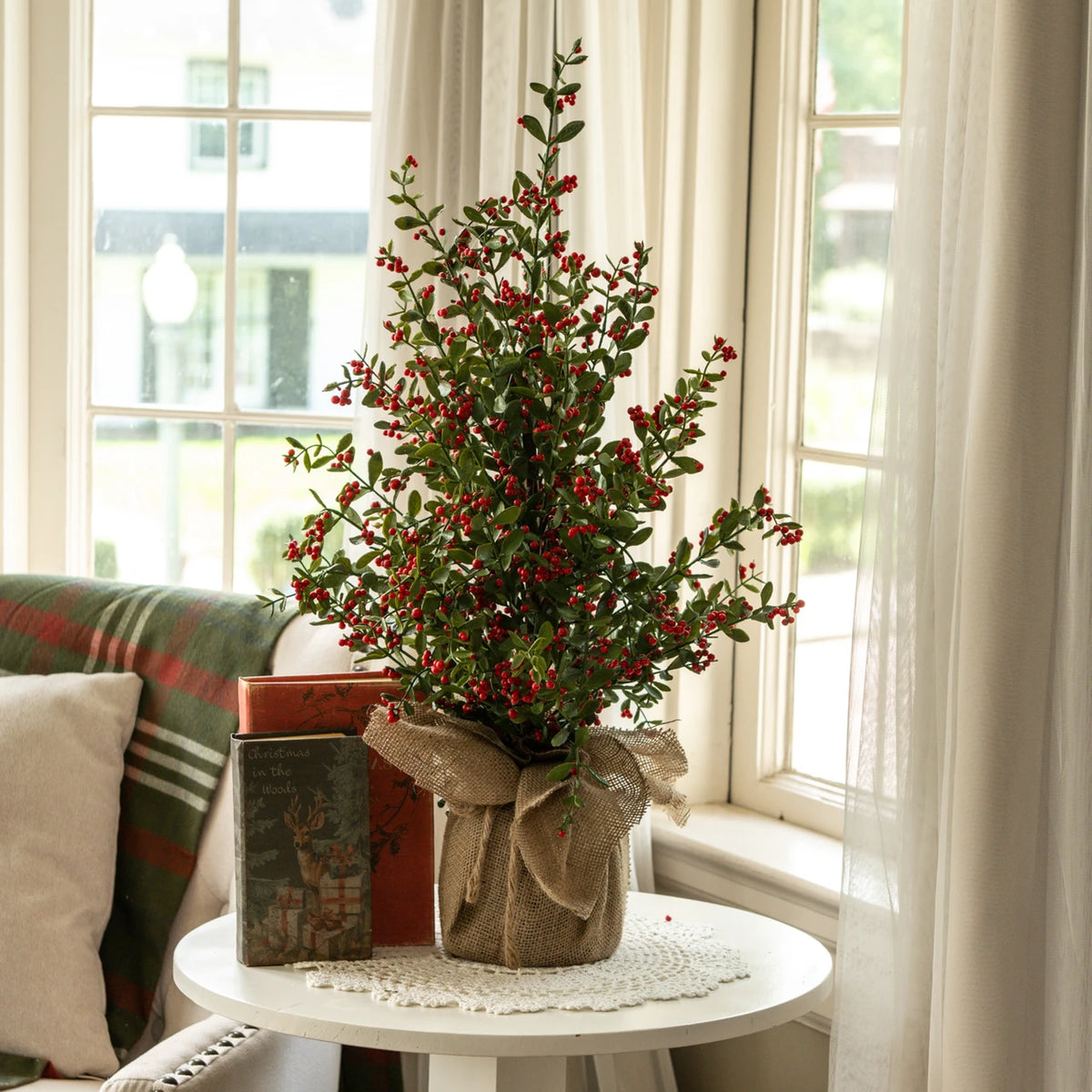 ruscus and red berry tree in burlap base at the rustic barn in killingworth ct