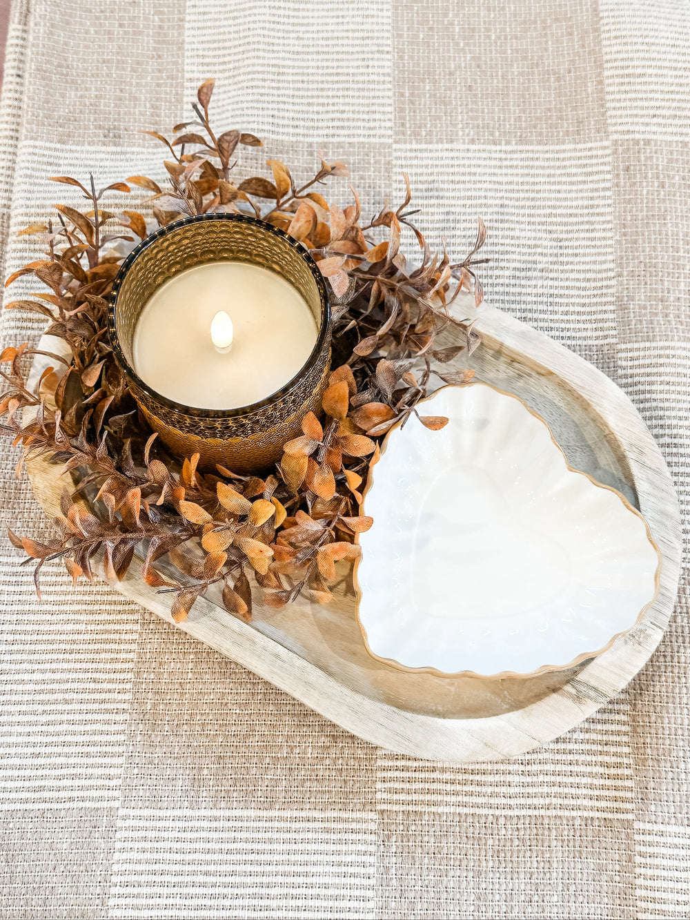Warm and cozy candle wooden tray display with fall candle ring and glass heart dish at the rustic barn in Killingworth, CT