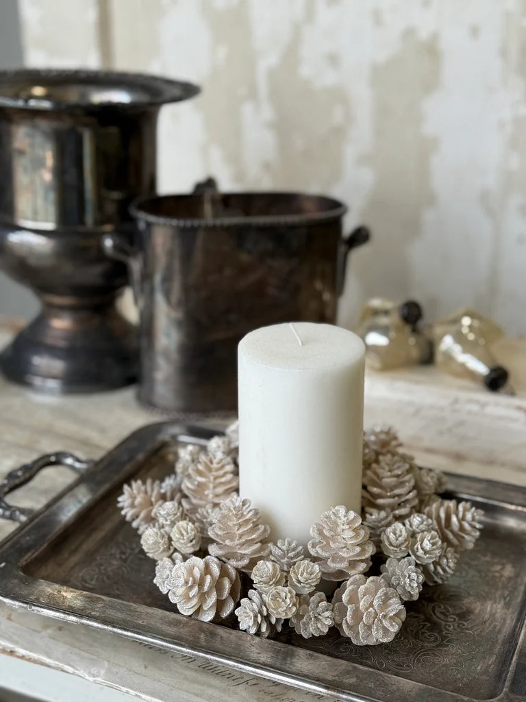 Shimmery sparkly ivory colored large candle ring with christmas pinecone for holiday decor at the rustic barn in killingworth, CT