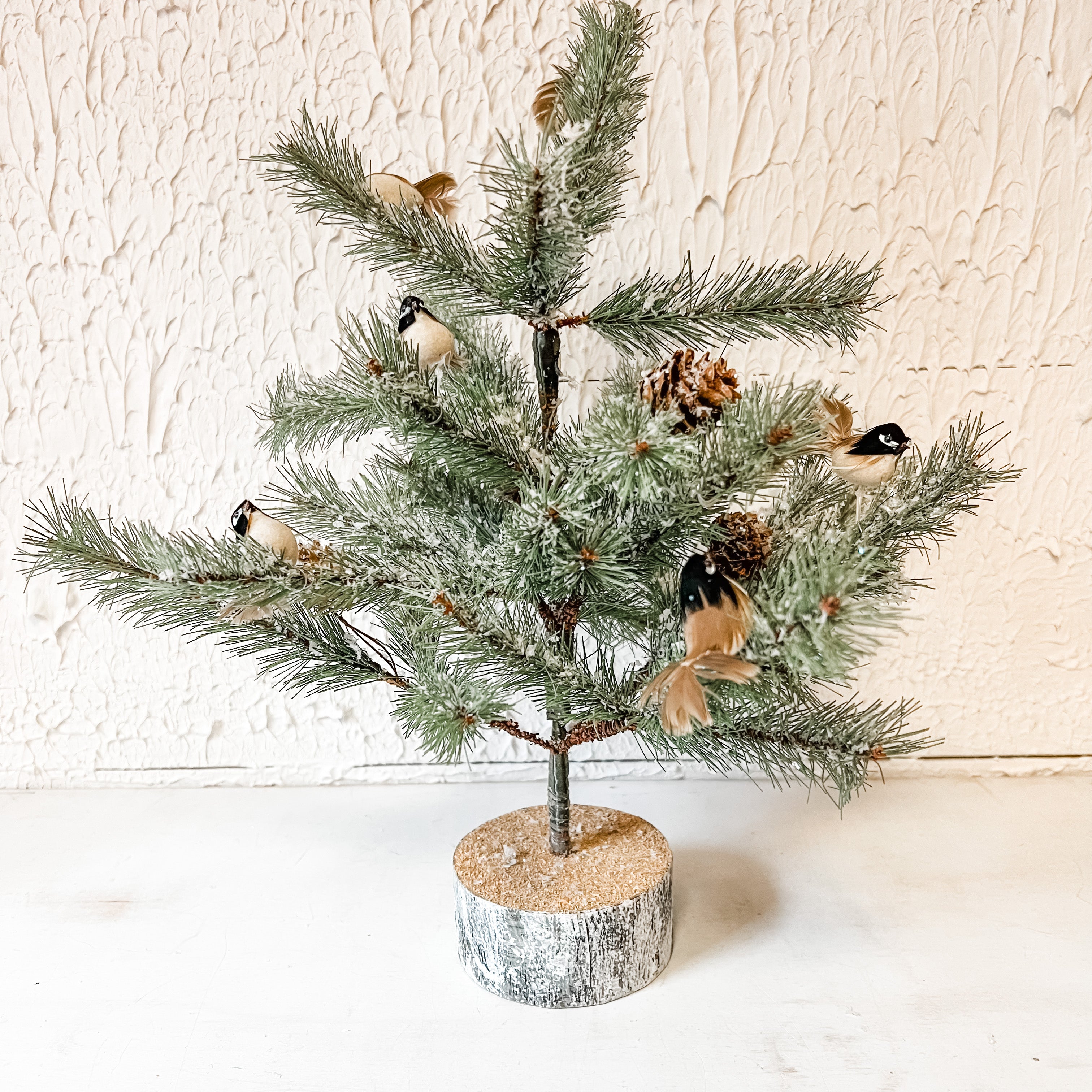 small pine tree on wood base with little birds and pinecones the rustic barn ct