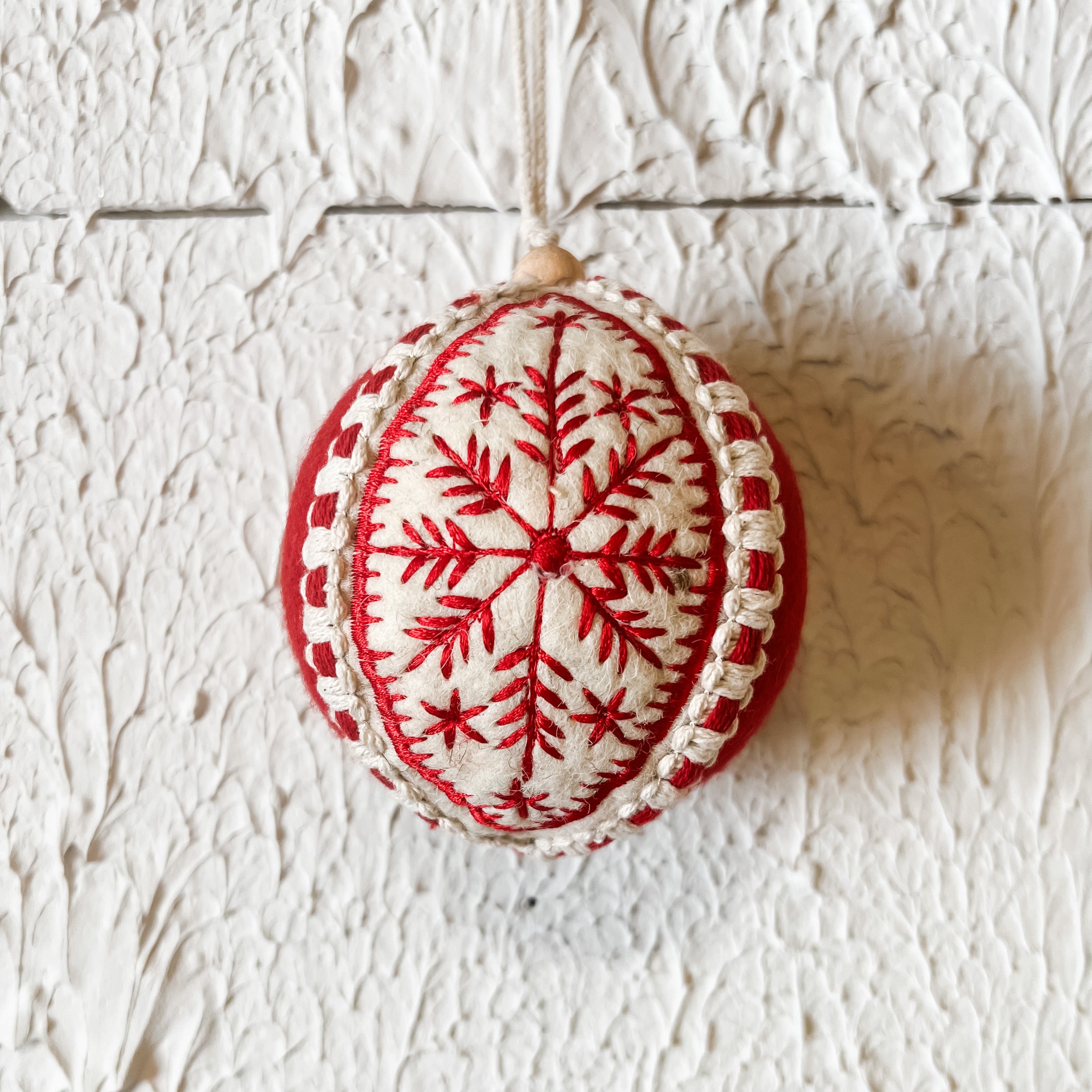 red and white embroidered round ornament the rustic barn ct