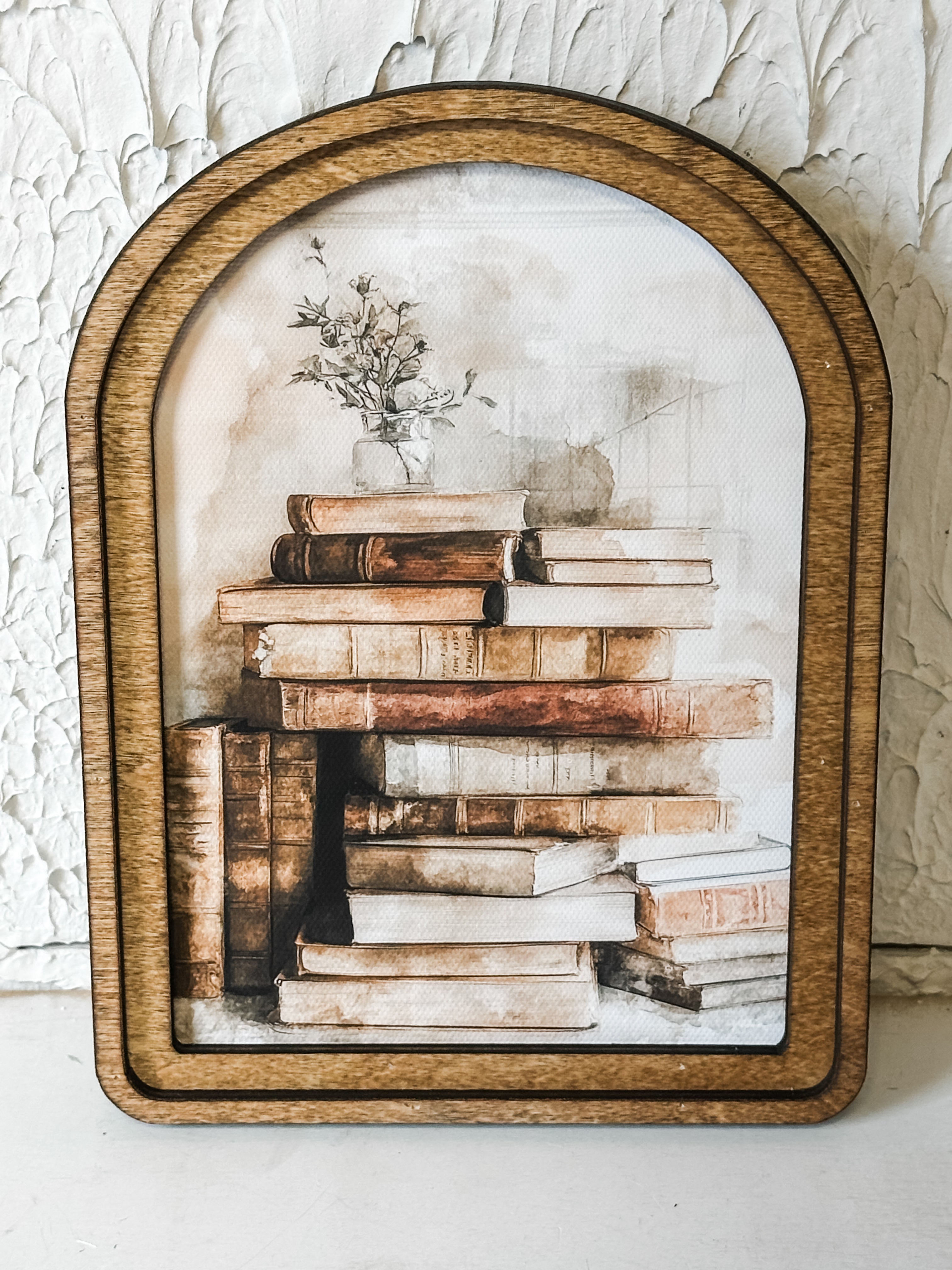 Arch Top Stacked Books Framed Wall Art at the Rustic Barn in Killingworth, CT