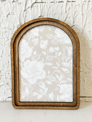 arched framed taupe and white floral wall decor at the rustic barn in killingworth ct
