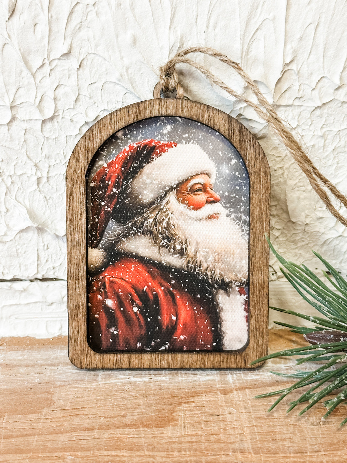arched wooden ornament with a vintage santa on it at the rustic barn in killingworth ct