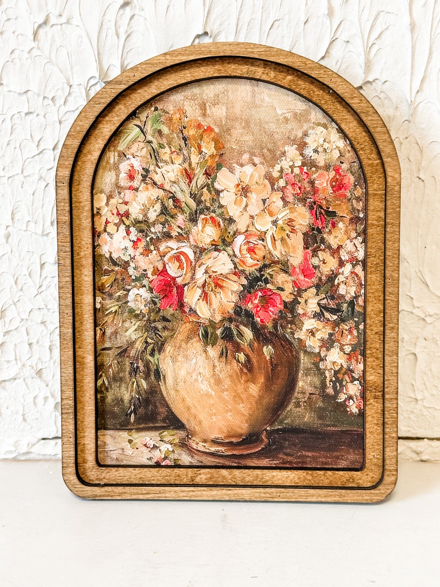 rustic vase with pink red and orange flowers wall decor at the rustic barn in killingworth ct