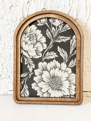 arched framed black and tan floral wall decor at the rustic barn in killingworth ct