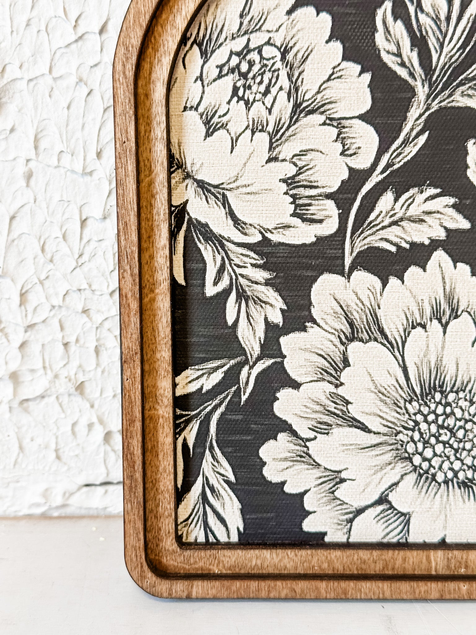 arched framed black and tan floral wall decor at the rustic barn in killingworth ct