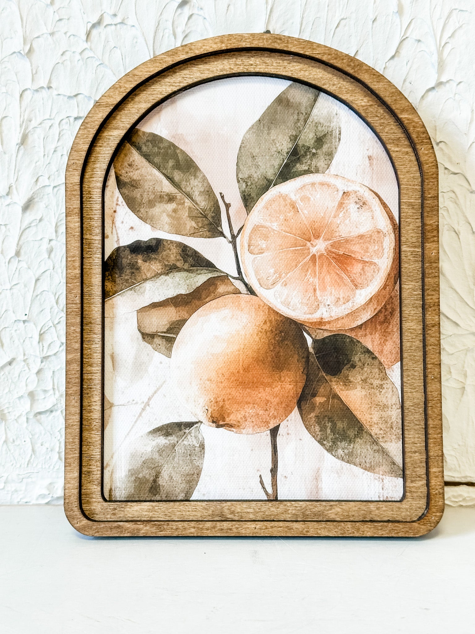 small arched wood framed picture of rustic lemons at the rustic barn in killingworth ct