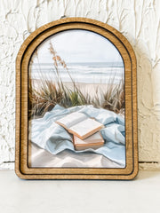 small arched wood framed beach scene print at the rustic barn in killingworth ct