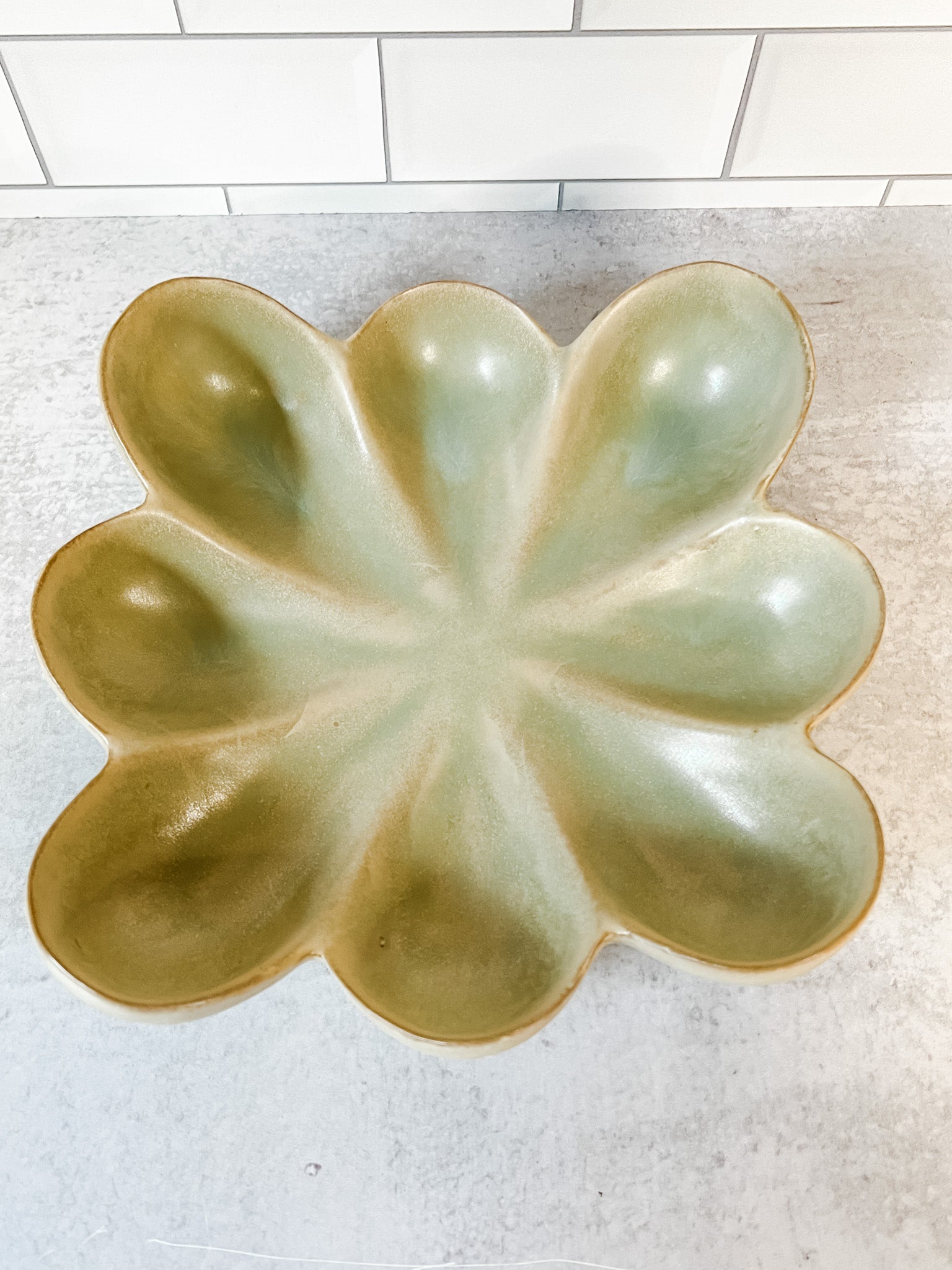 green reacitve glaze stoneware flower dish at the rustic barn in killingworth ct