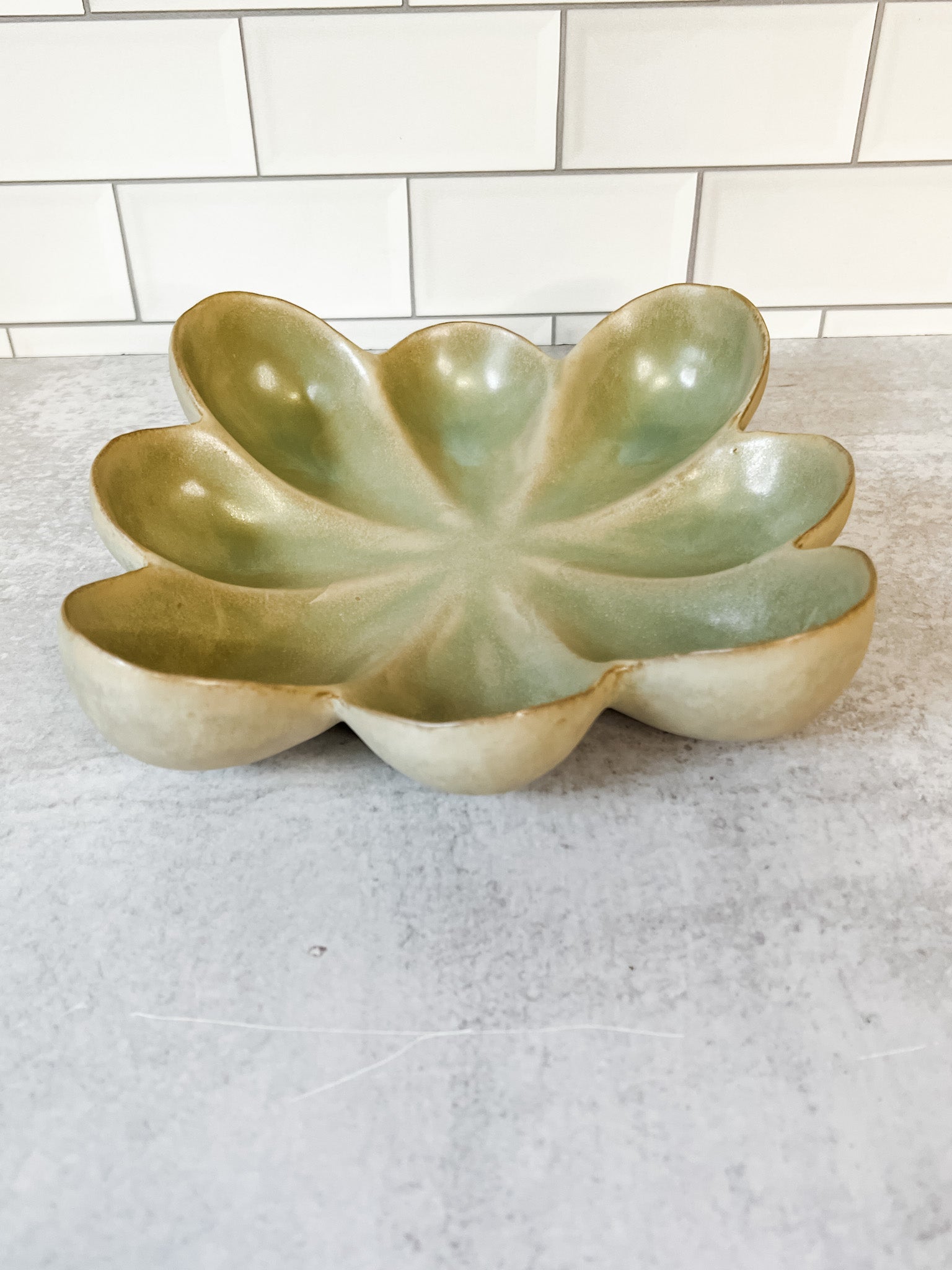 green reacitve glaze stoneware flower dish at the rustic barn in killingworth ct