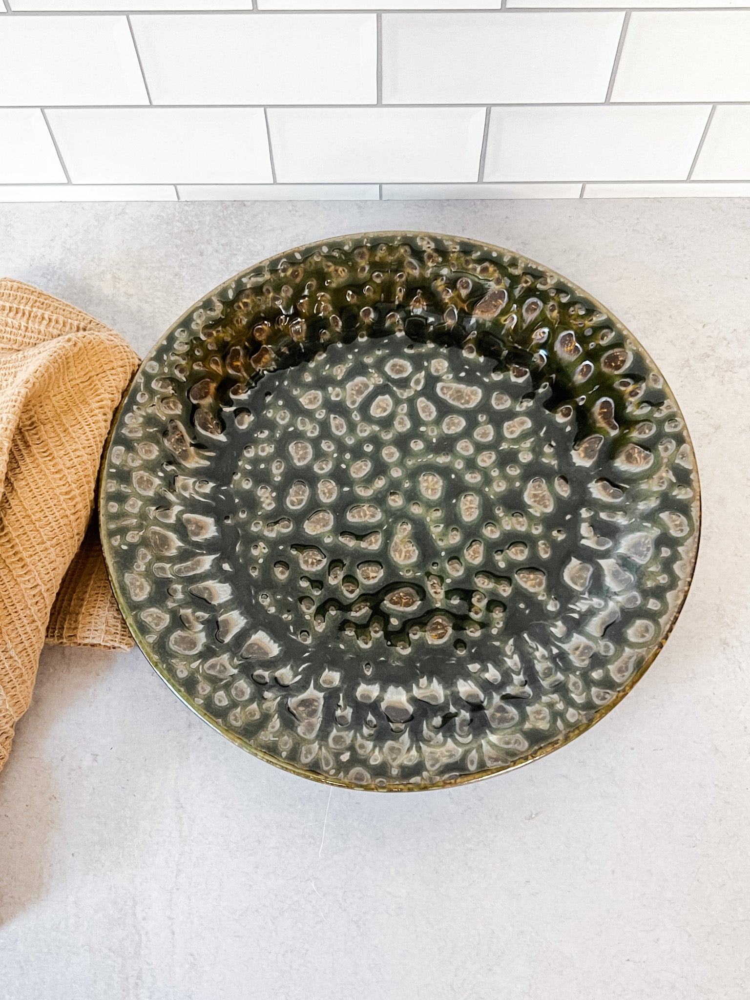 moss green stoneware reactive glaze plate at the rustic barn in killingworth ct