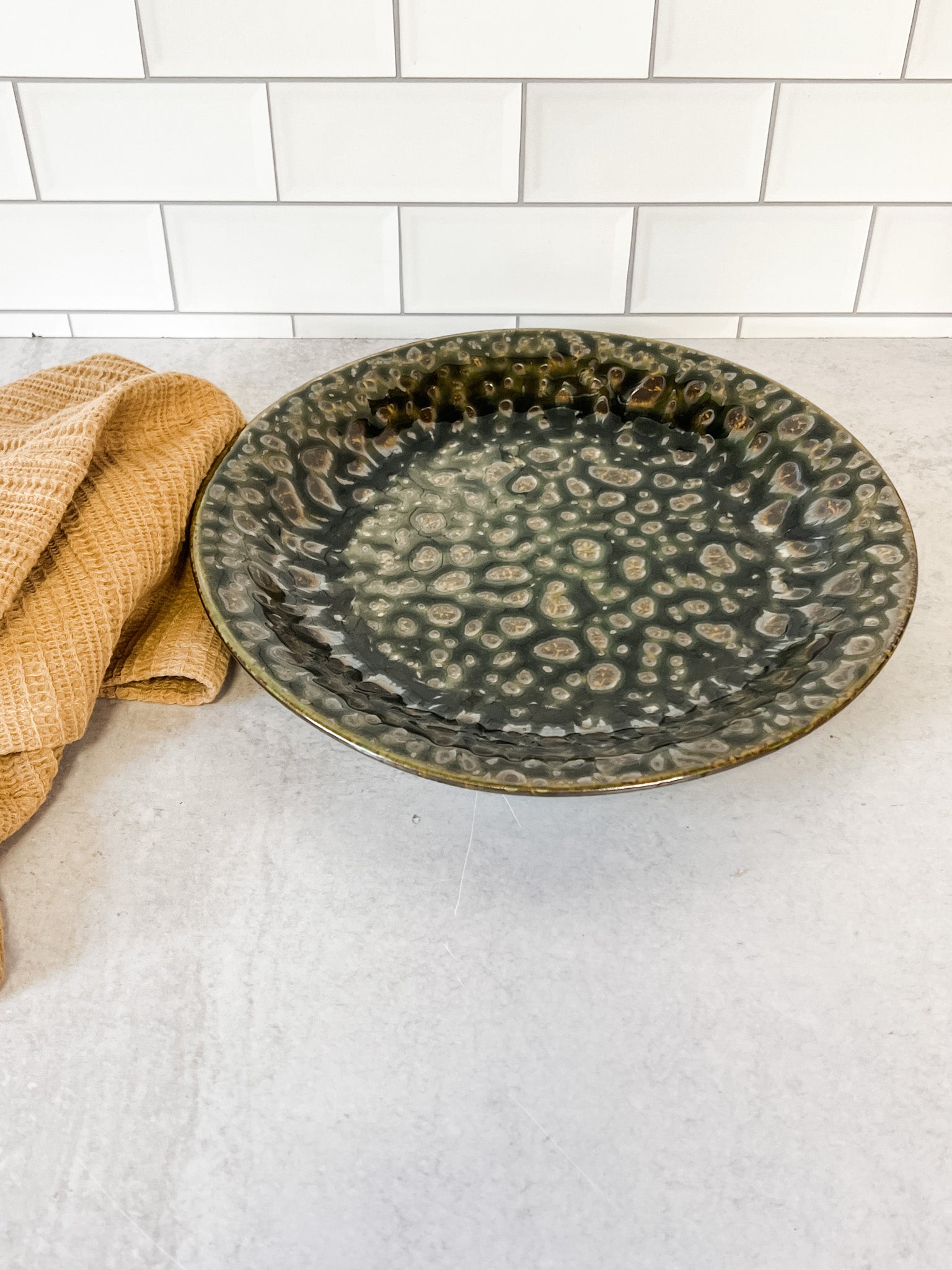 moss green stoneware reactive glaze plate at the rustic barn in killingworth ct