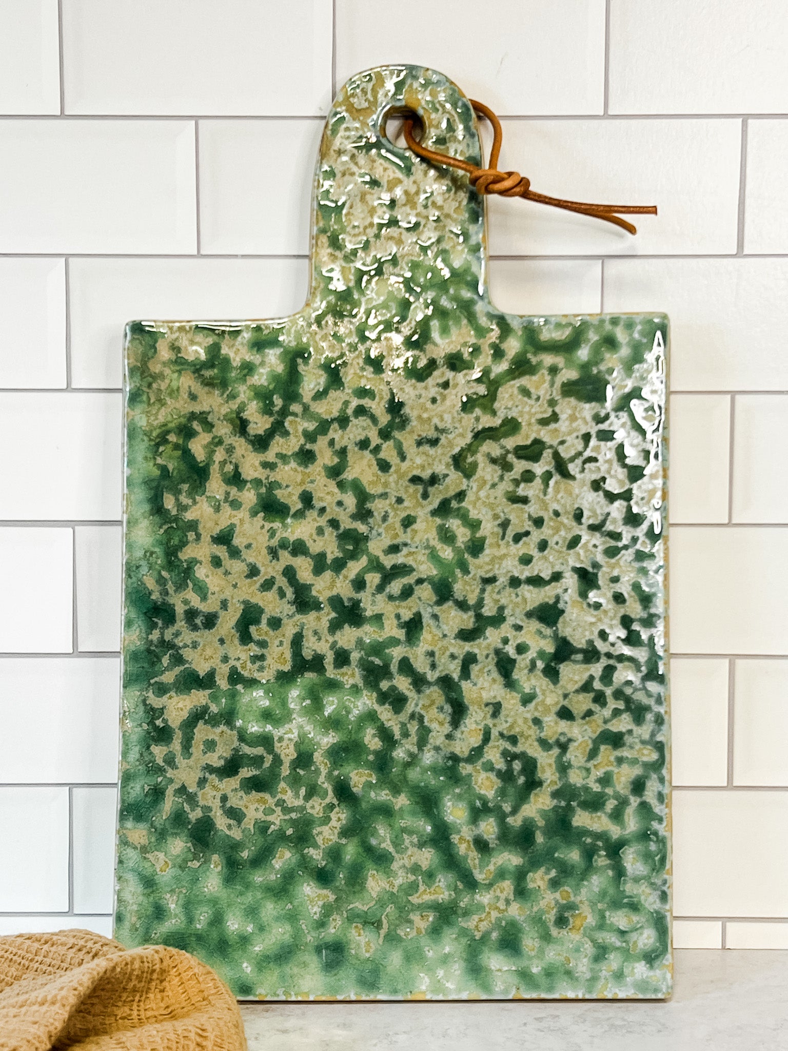 green and beige moss green stoneware cheese board at the rustic barn in killingworth ct
