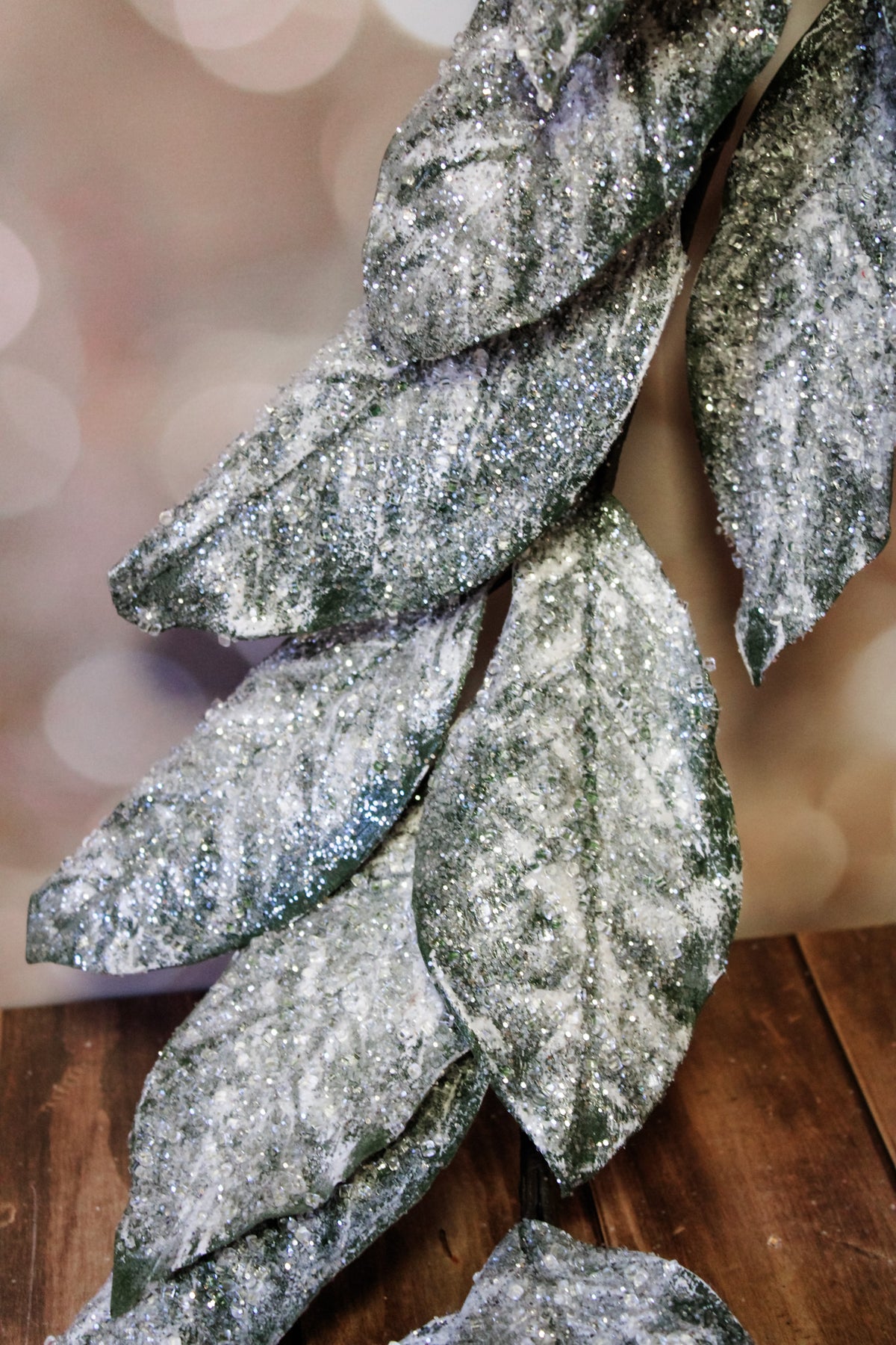 gorgeous frosted ice faux garland floral with magnolia leaves and sparkly glittery elements for christmas holiday home decorating for sale at the rustic barn in Killingworth, CT