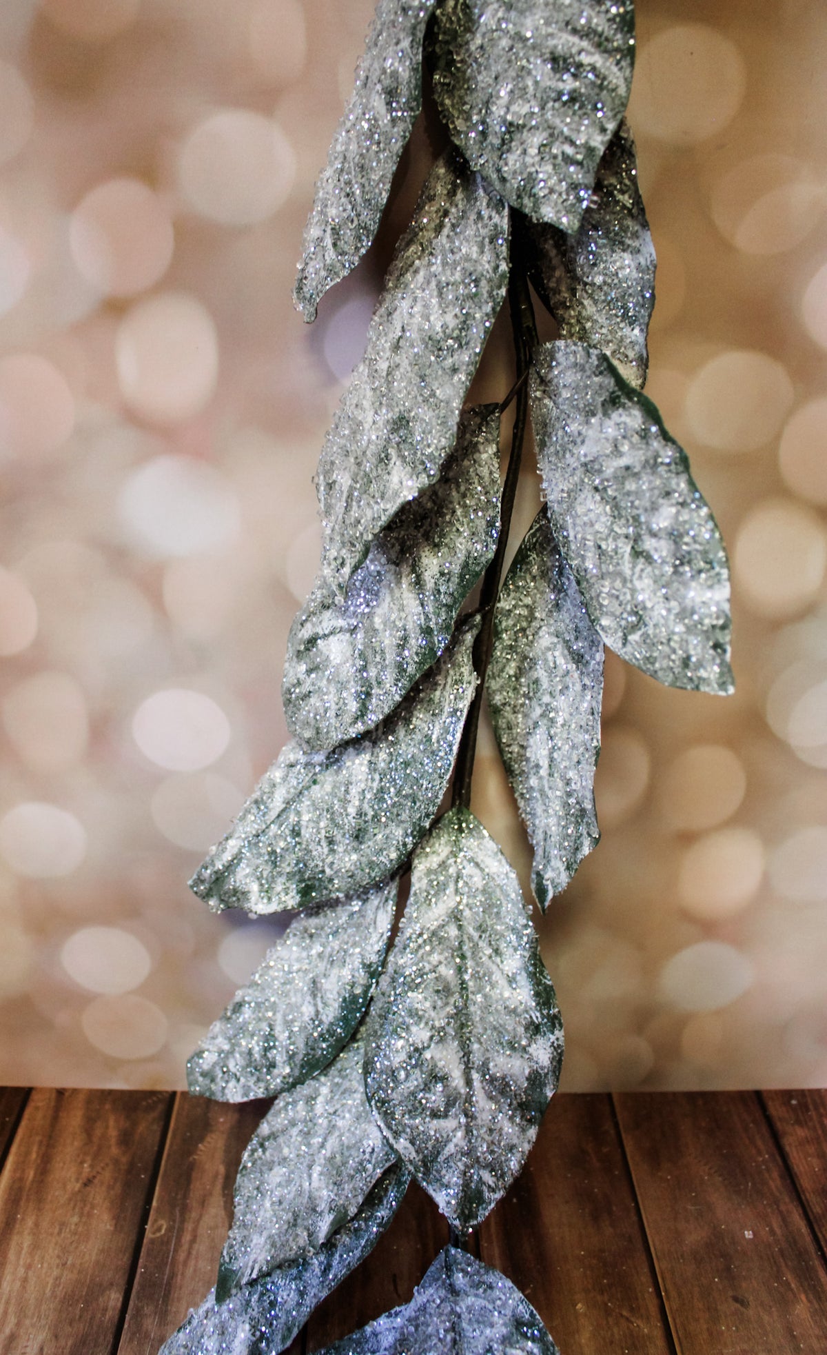gorgeous frosted ice faux garland floral with magnolia leaves and sparkly glittery elements for christmas holiday home decorating for sale at the rustic barn in Killingworth, CT