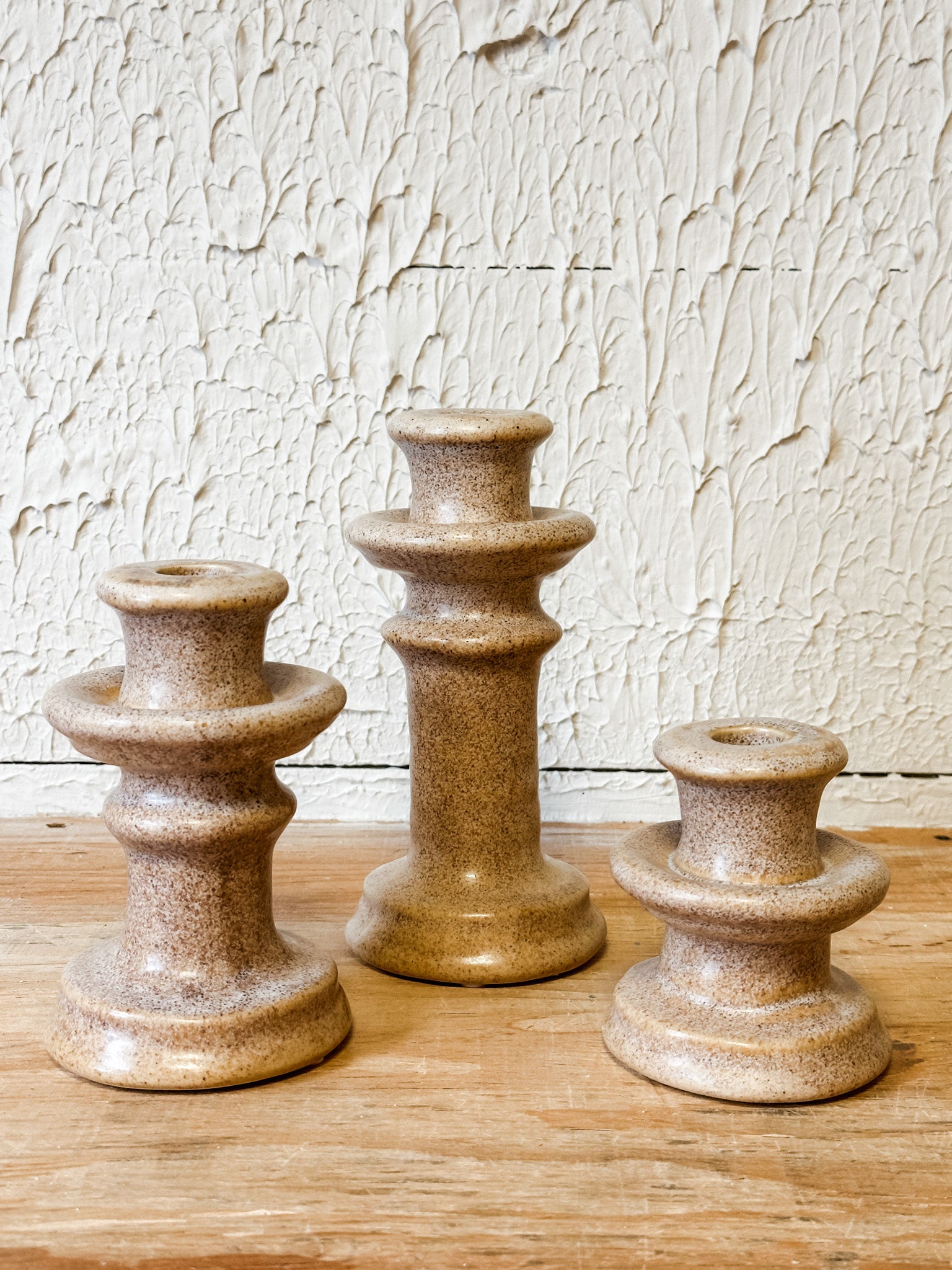 3 sizes cream ceramic taper holders at the rustic barn in killingworth ct