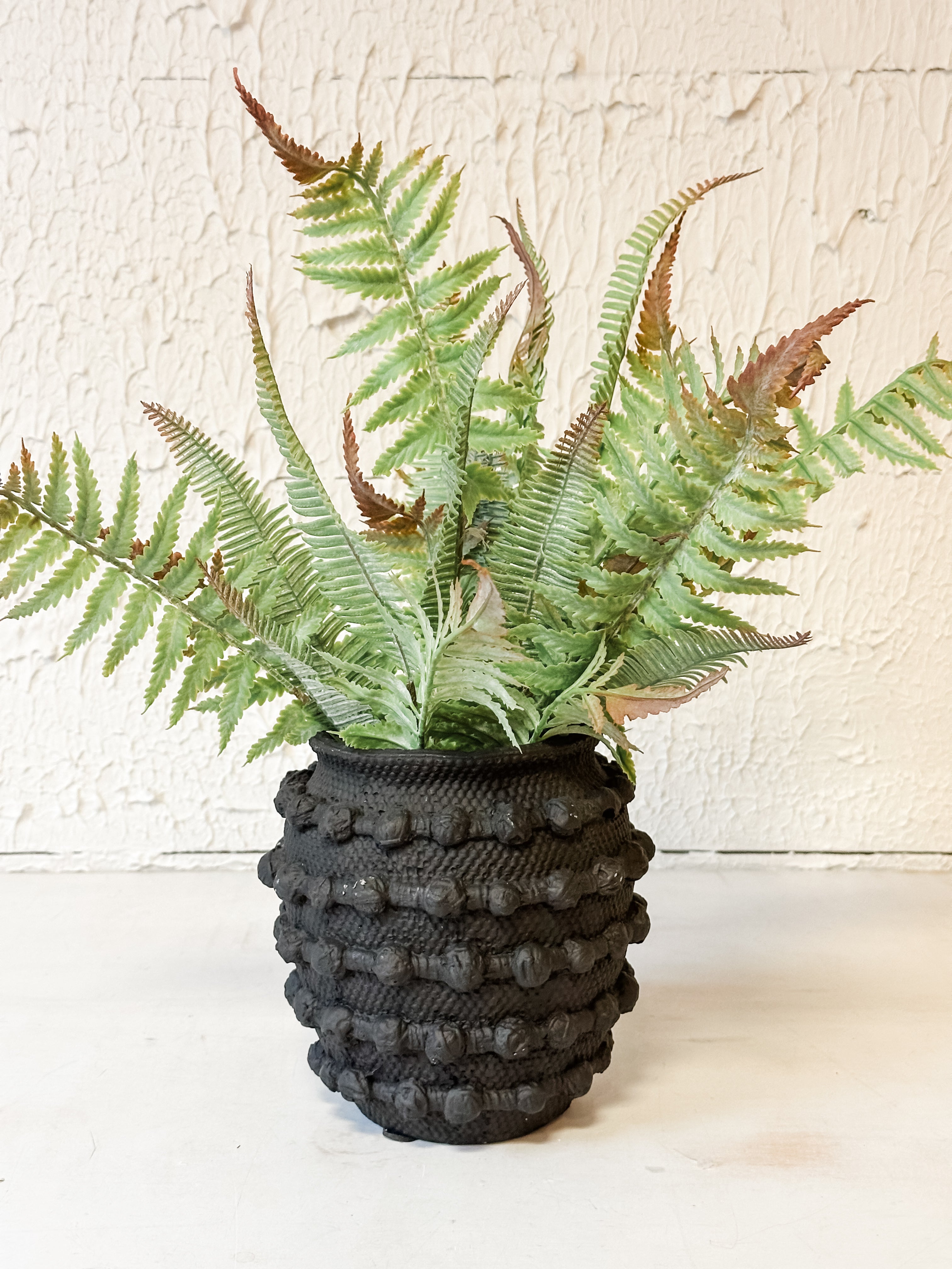 black textured knot cement vase with faux fern at The Rustic Barn in Killingworth CT