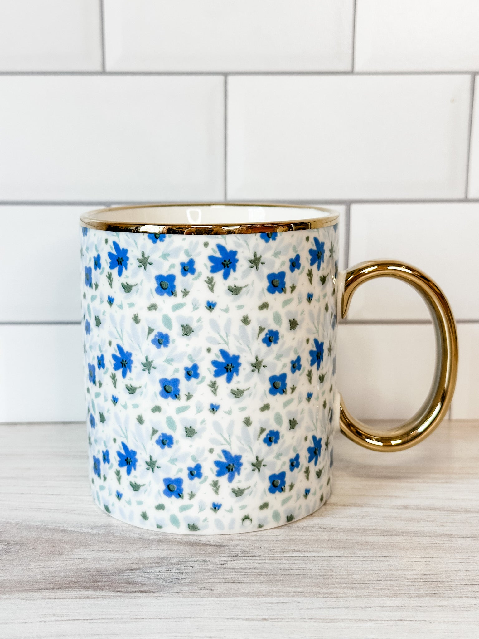 blue and white floral mug with gold handle at the rustic barn in killingworth ct