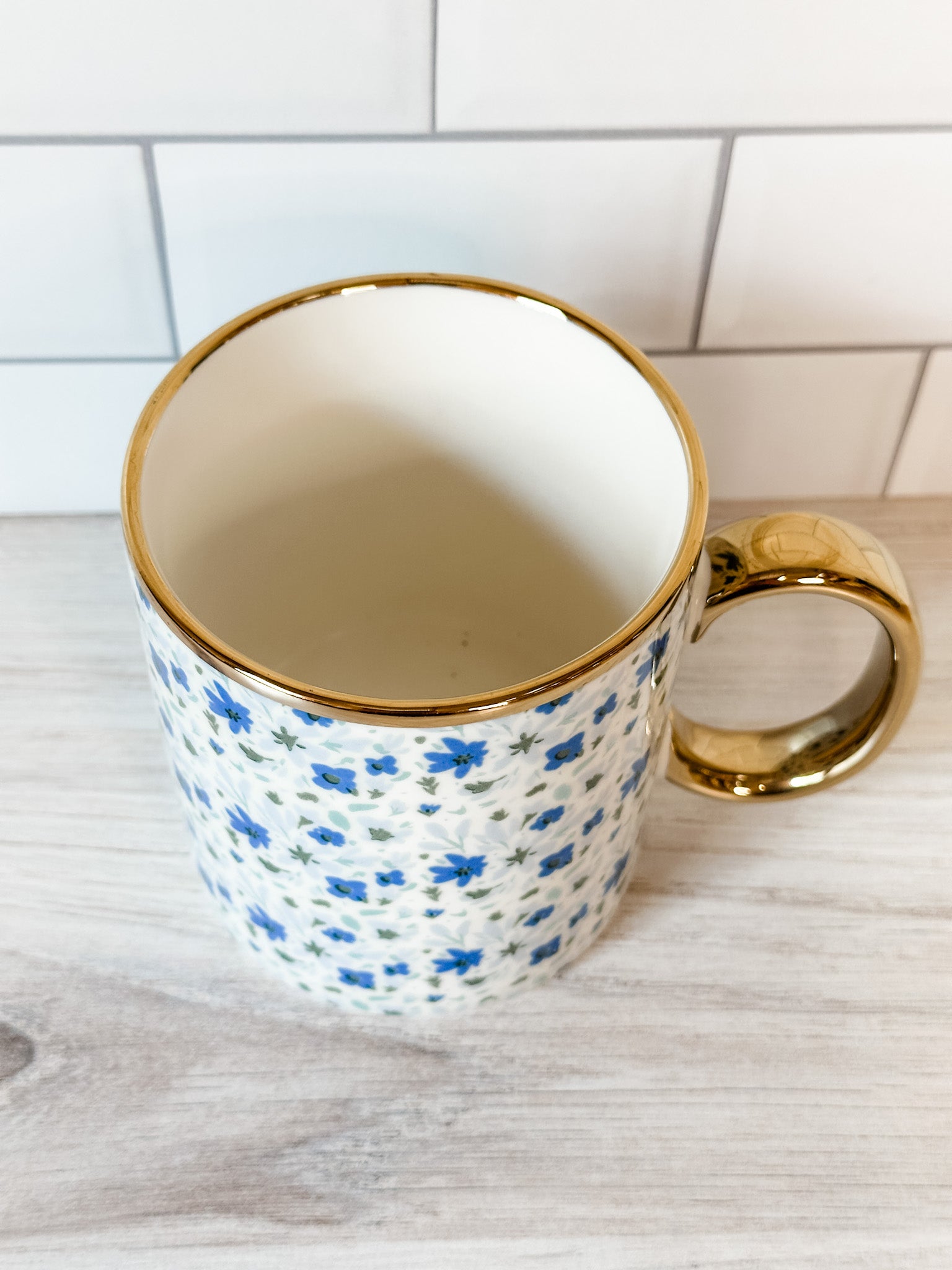 blue and white floral mug with gold handle at the rustic barn in killingworth ct