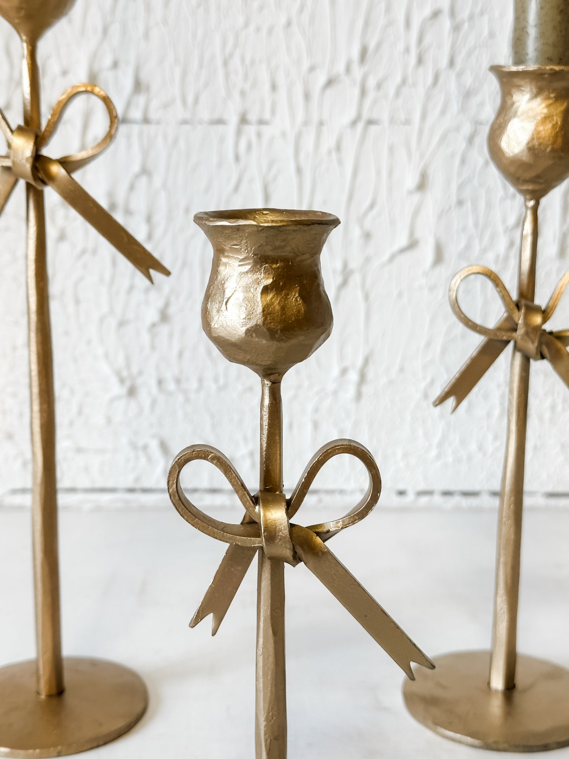 bow accent iron taper holders at the Rustic Barn in Killingworth, CT