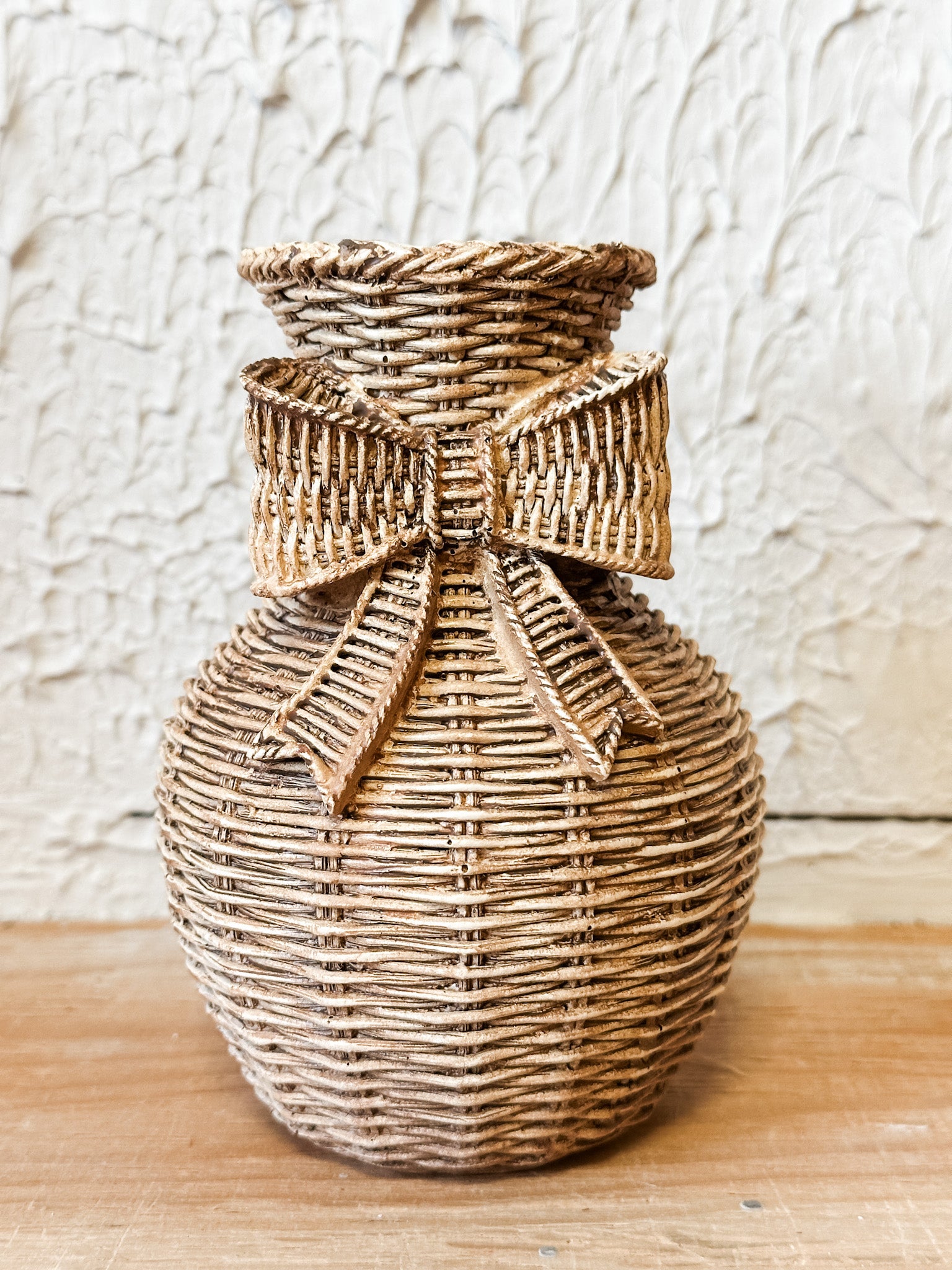 resin basket weave vase with bow at the rustic barn in killingworth ct