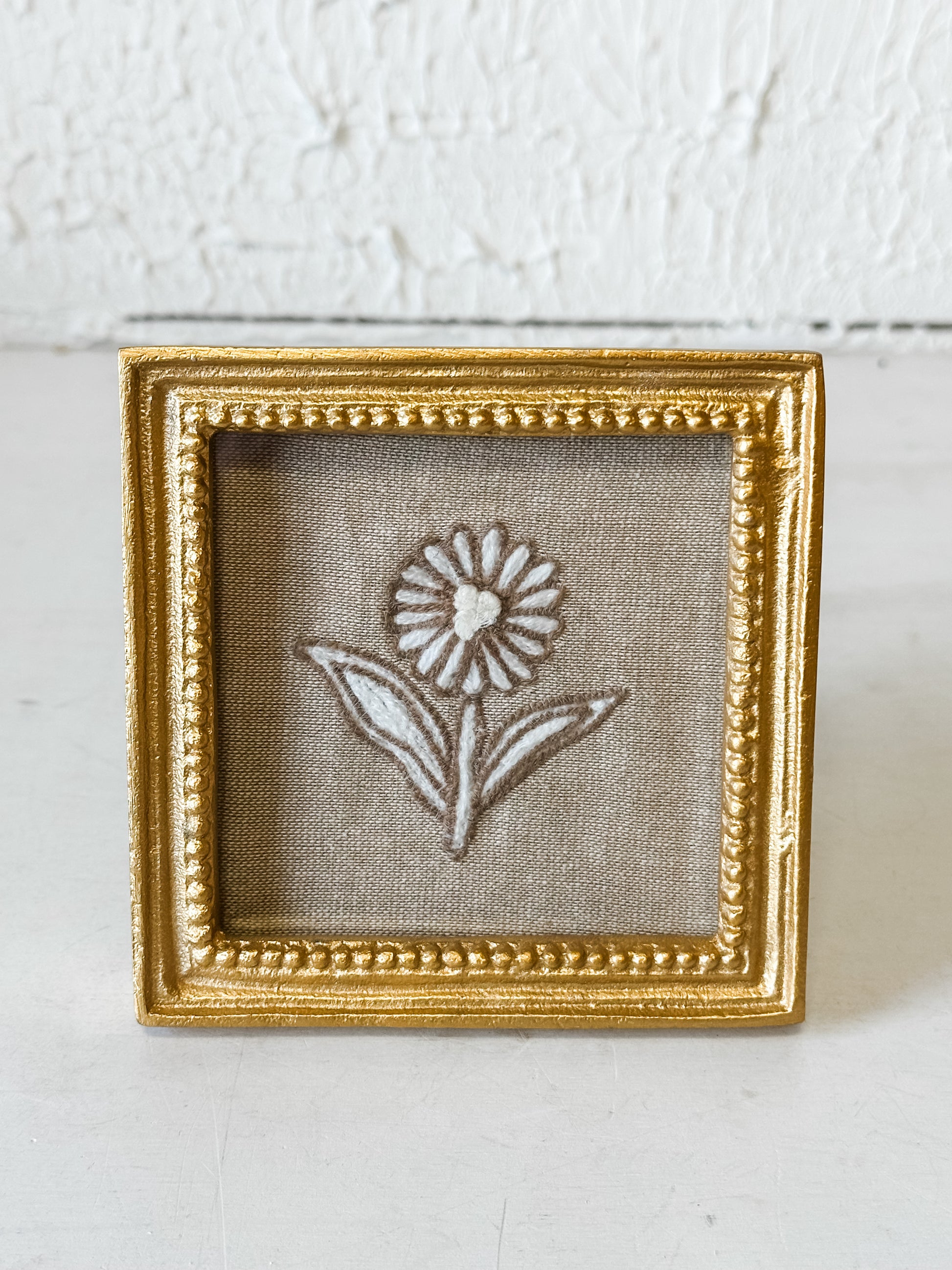 Brass Framed Embroidered Flower Art at the Rustic Barn in Killingworth, CT