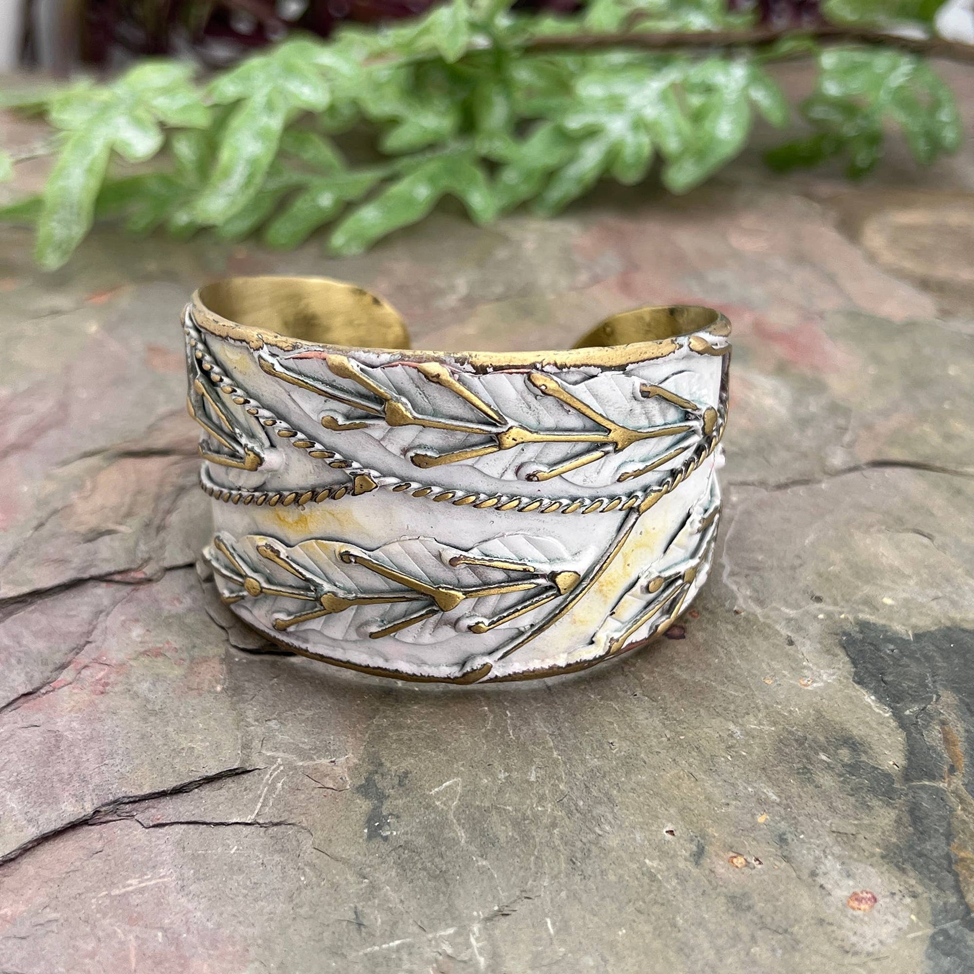 brass patina cuff bracelet with white leaaves at the rustic barn in killingworth ct