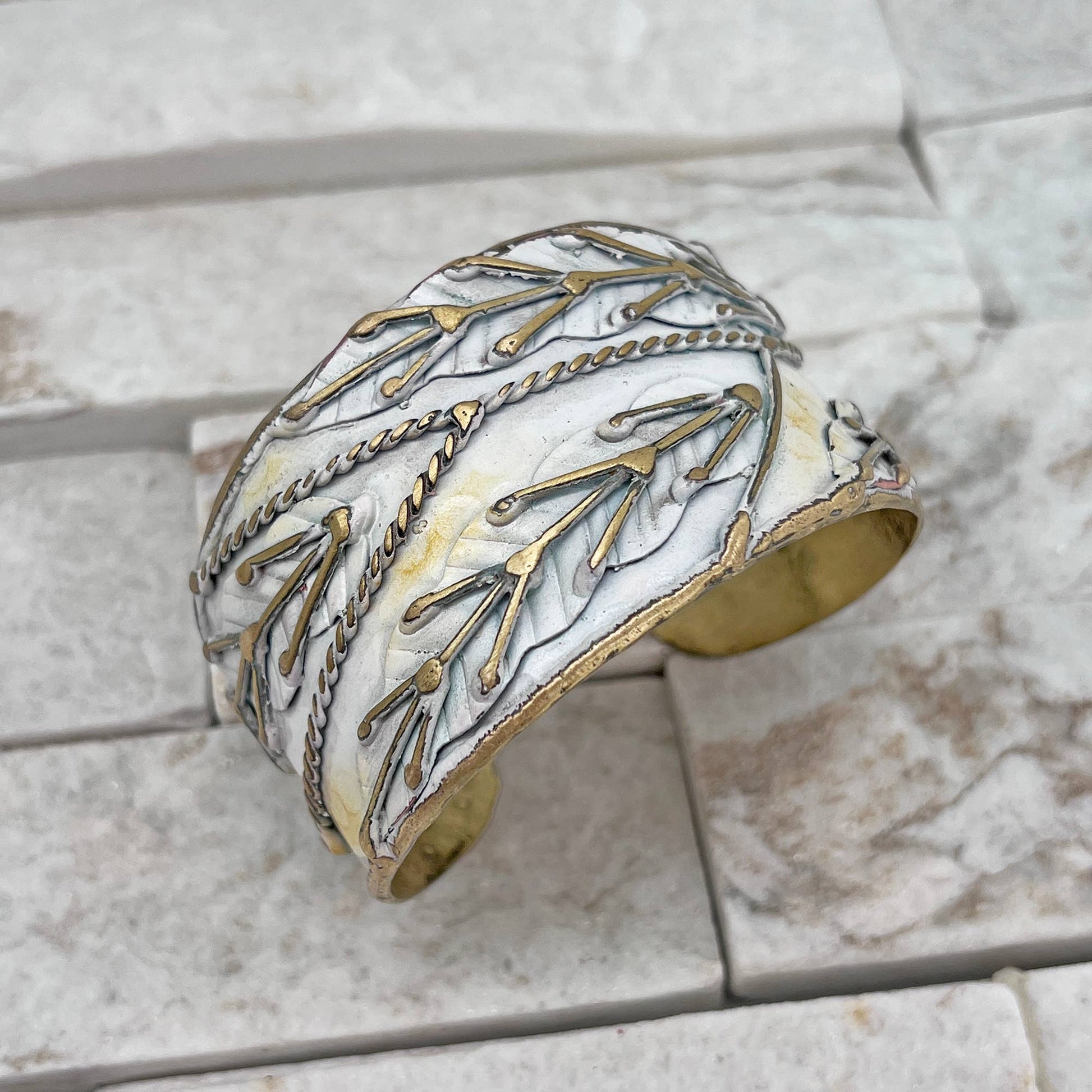 brass patina cuff bracelet with white leaaves at the rustic barn in killingworth ct