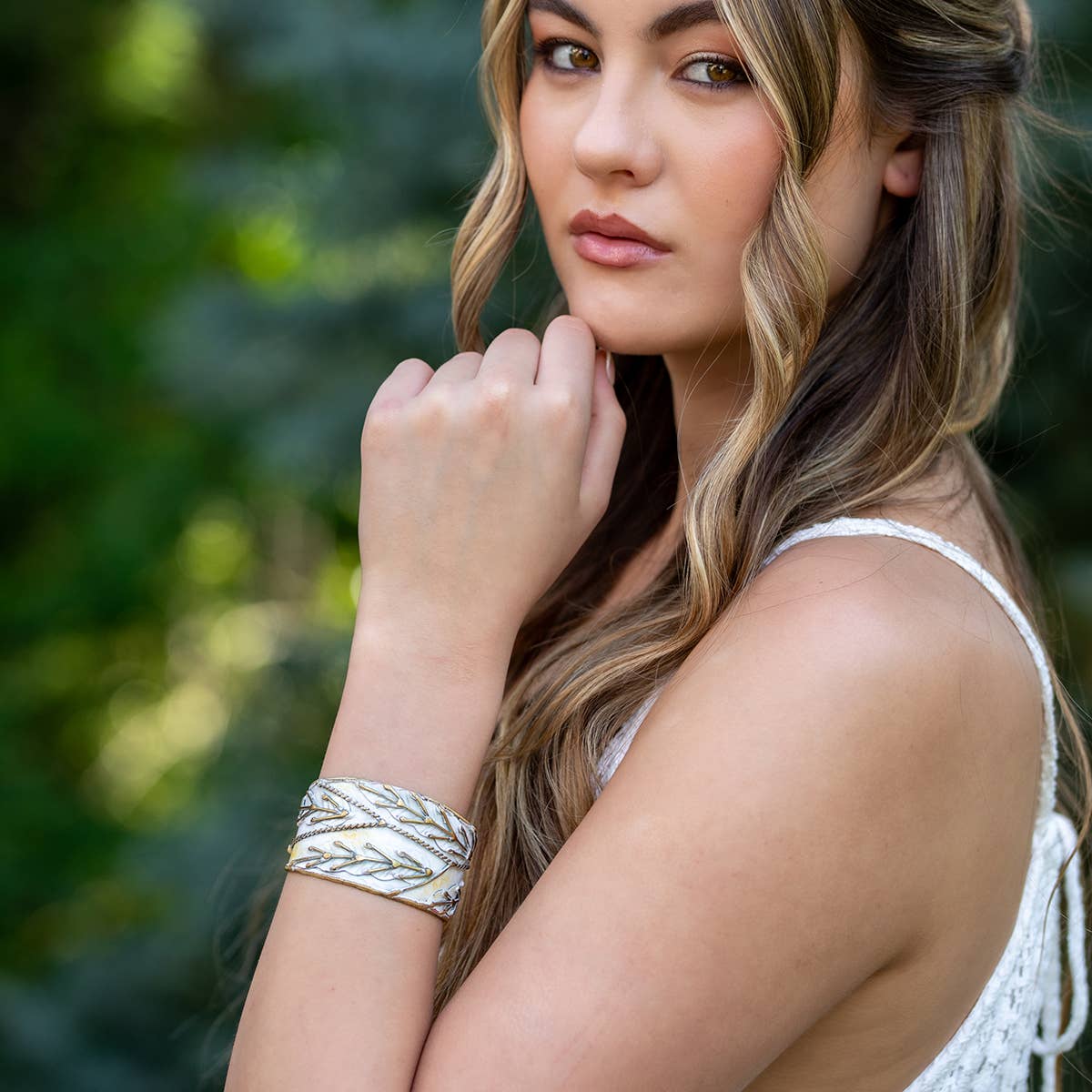 brass patina cuff bracelet with white leaaves at the rustic barn in killingworth ct