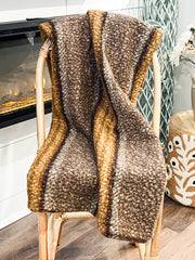 brown and gold faux sherpa throw at the rustic barn in killingworth ct