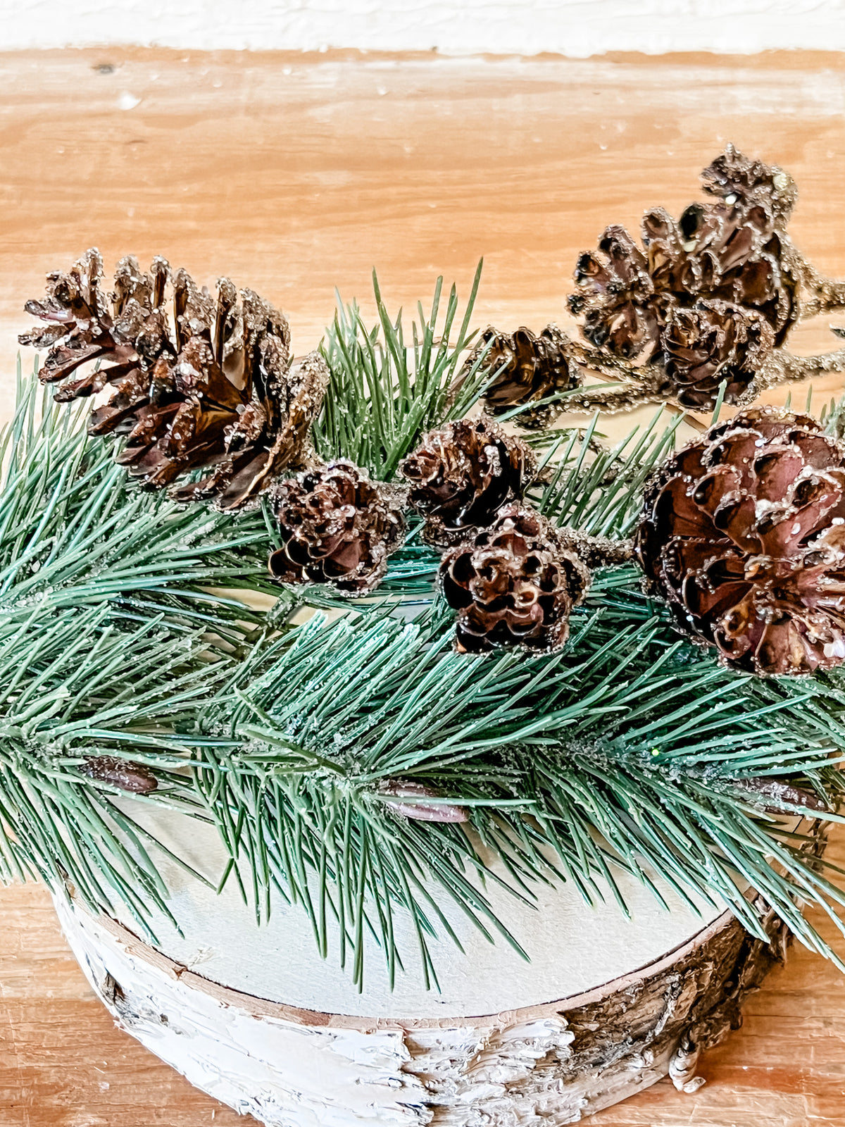 brown and gray faux pine cone spray at the rustic barn in killingworth ct
