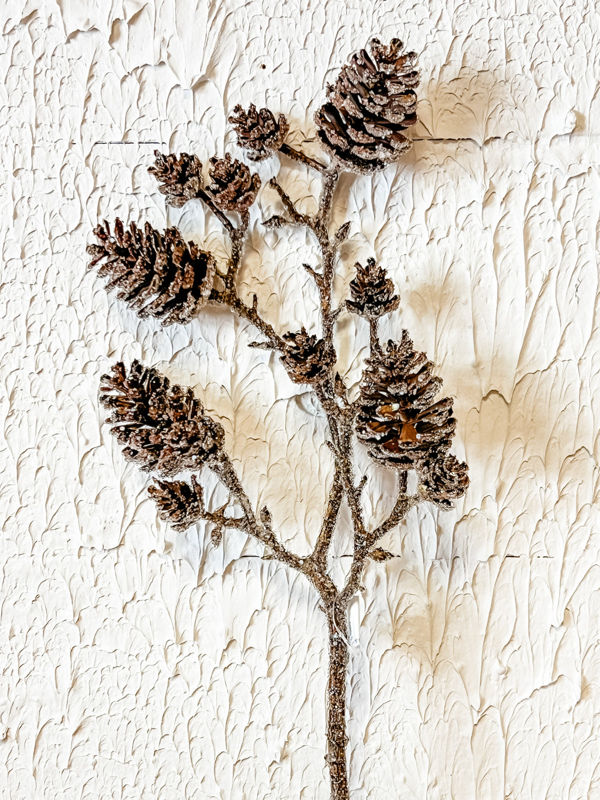 brown and gray faux pine cone spray at the rustic barn in killingworth ct