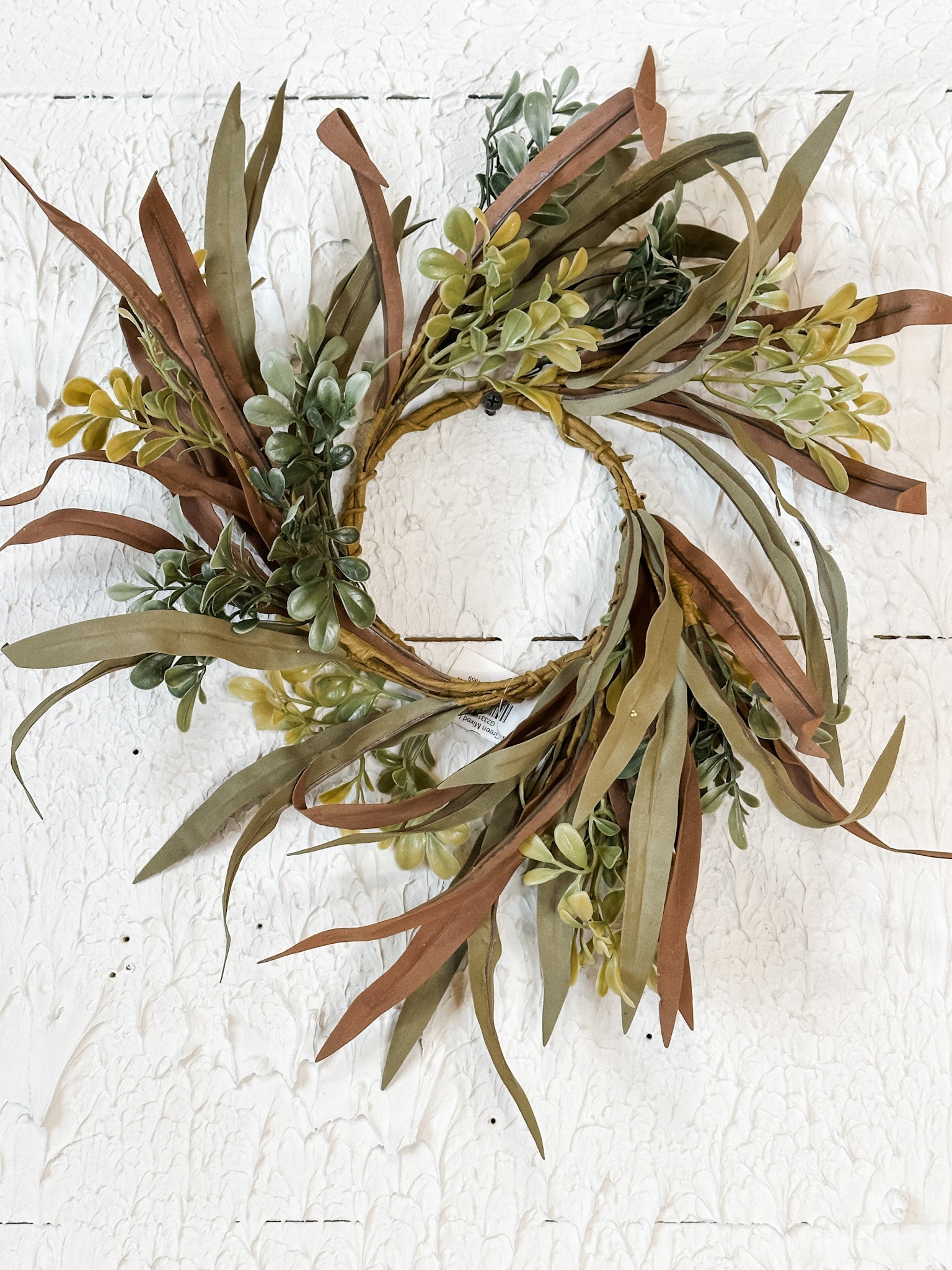 brown and green mixed leaf candle ring at the rustic barn in killingworth ct
