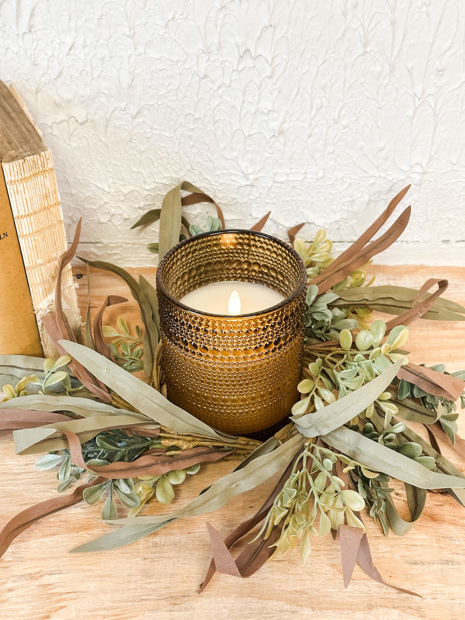 brown and green mixed leaf candle ring at the rustic barn in killingworth ct
