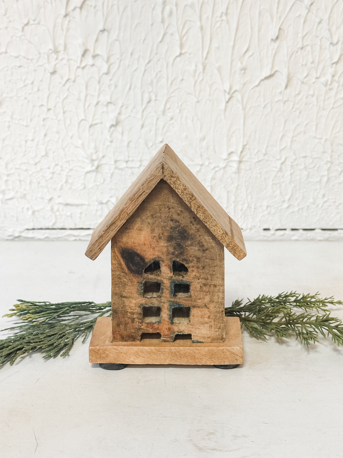 small carved mango wood houses at The Rustic Barn in Killingworth CT