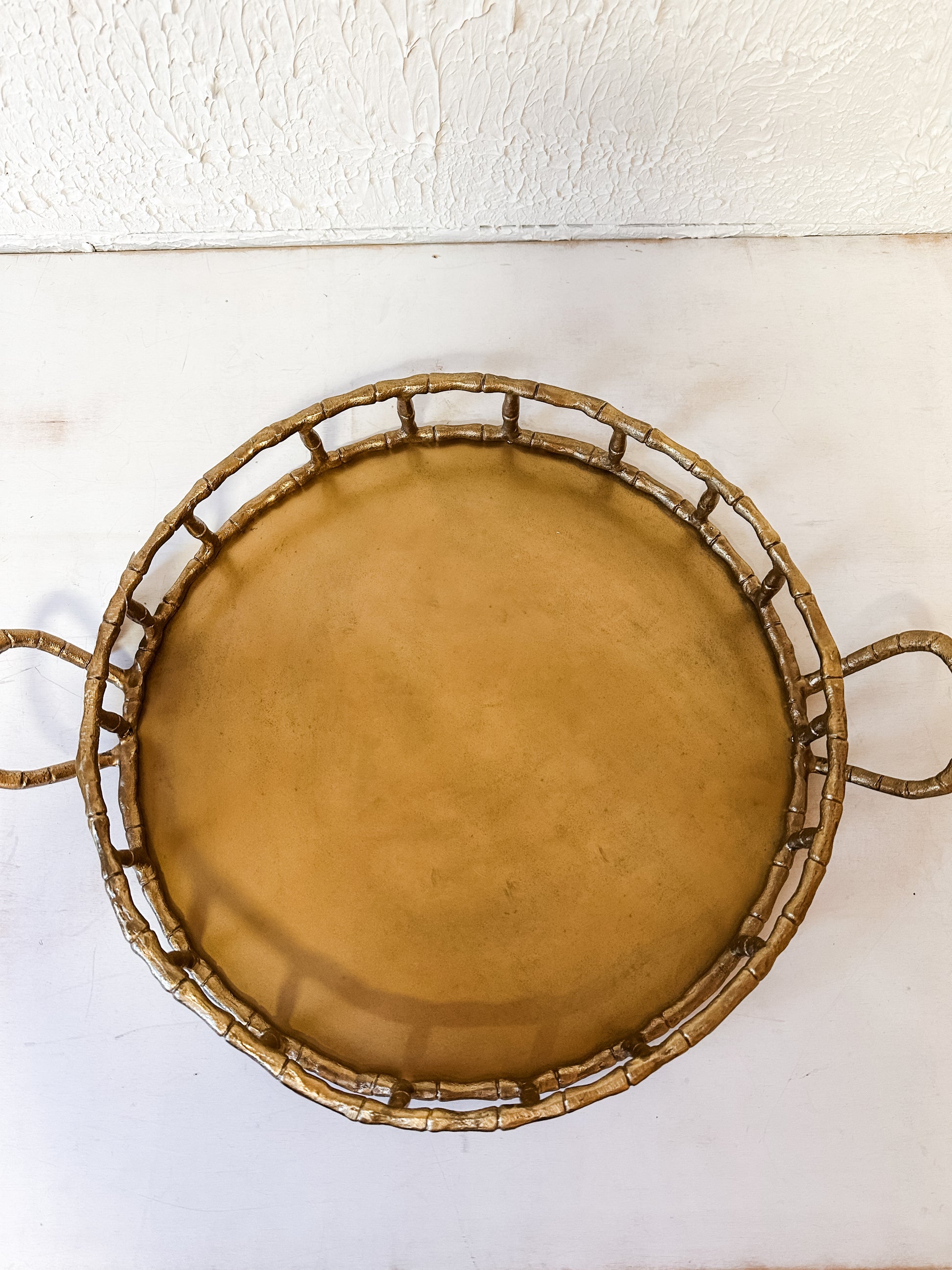 cast aluminum round tray with handles and brass finish at the Rustic Barn in Killingworth CT