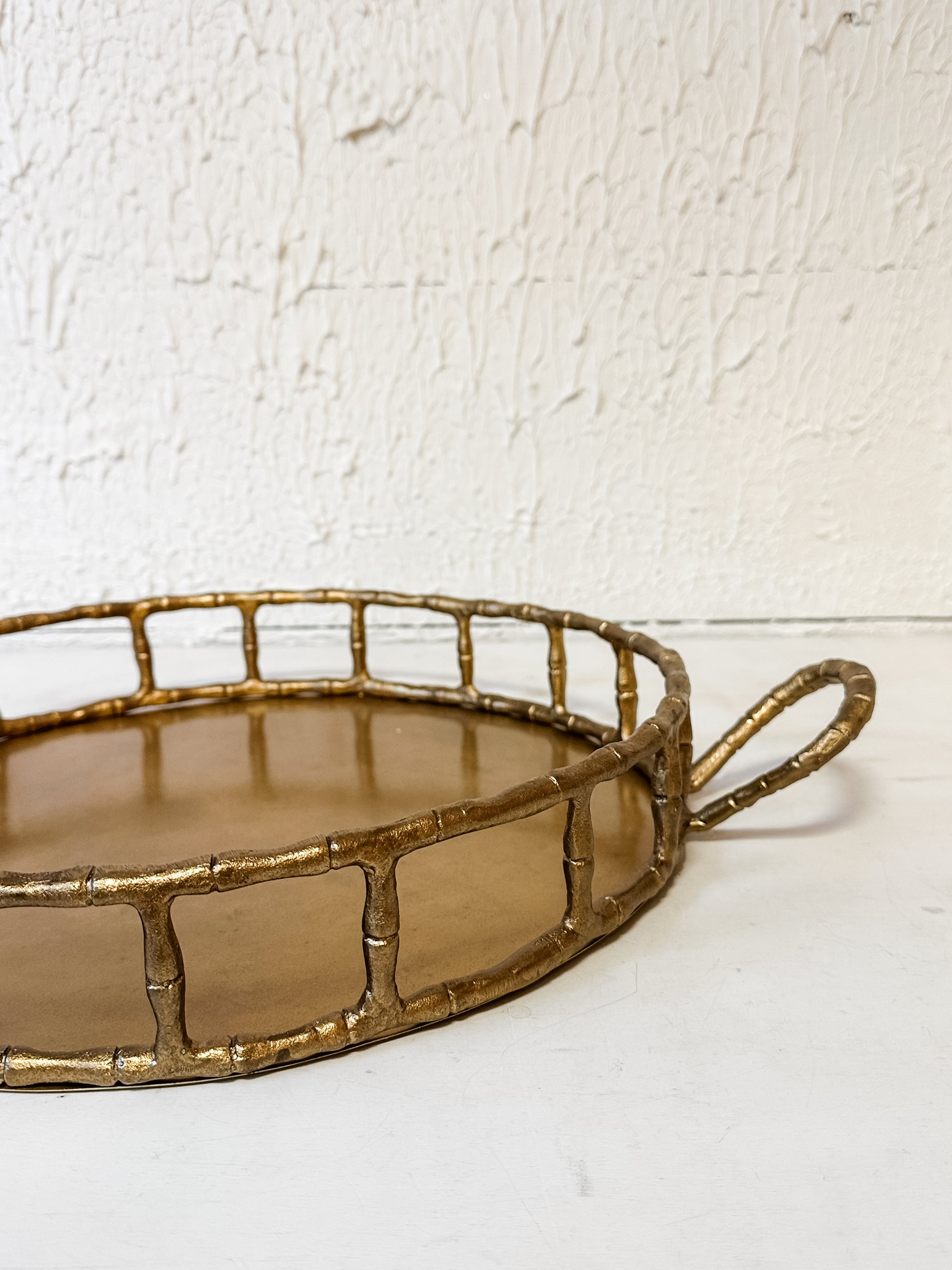 cast aluminum round tray with handles and brass finish at the Rustic Barn in Killingworth CT