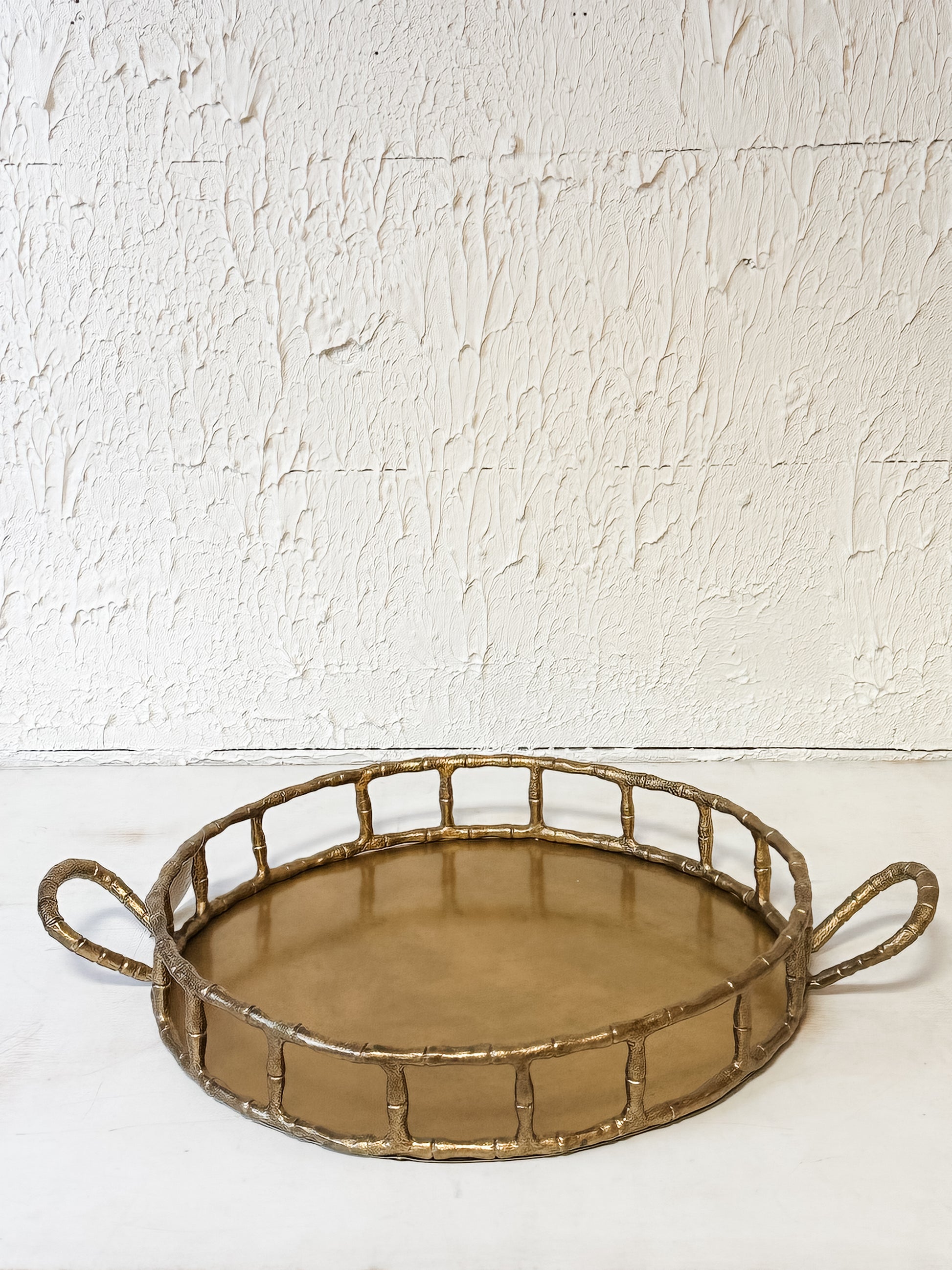 cast aluminum round tray with handles and brass finish at the Rustic Barn in Killingworth CT