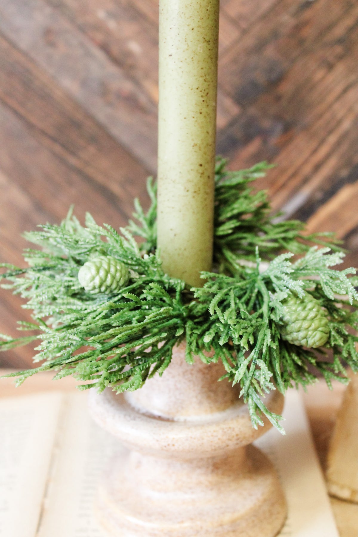 beautiful green cedar taper candle ring for christmas with green pinecone design for the holidays for sale at the rustic barn in killingworth, CT