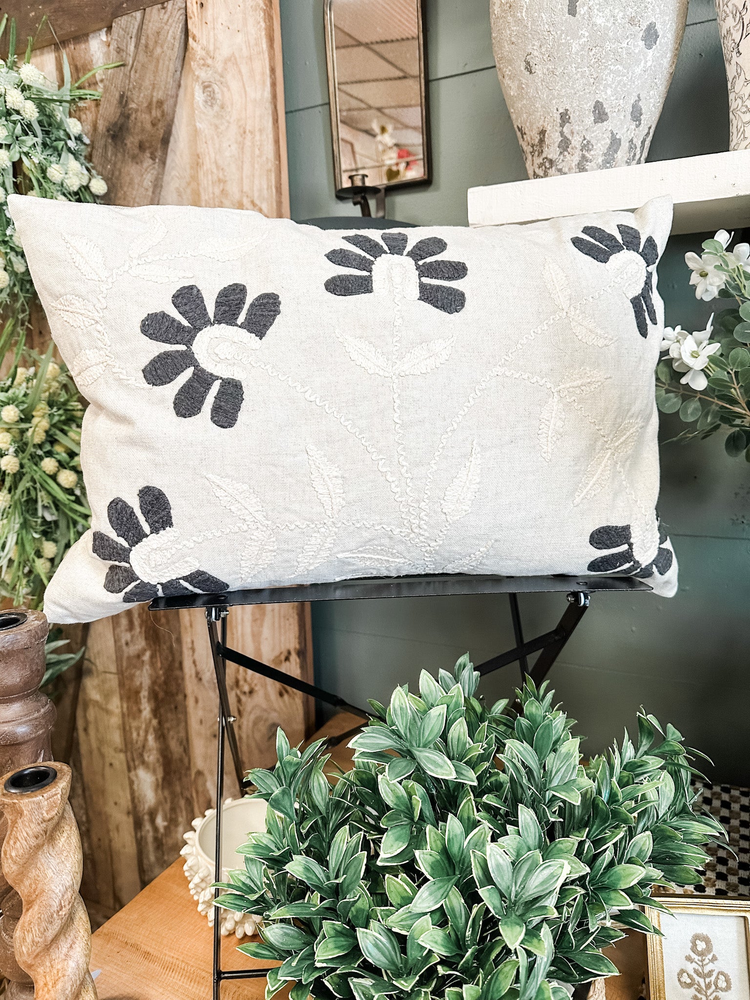 hand embroidered charcoal petal lumbar pillow at the rustic barn in killingworth ct
