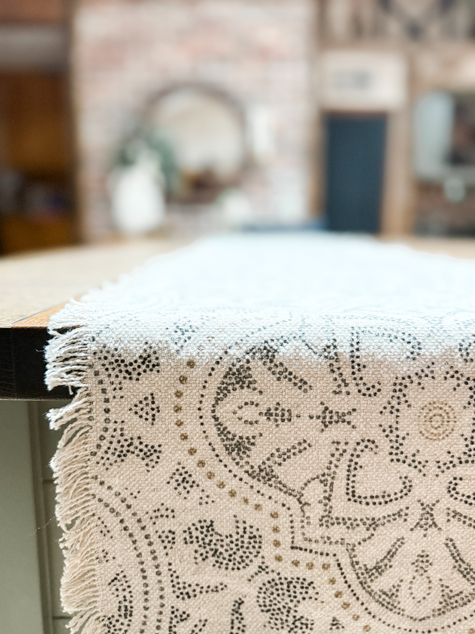 cotton cream 72 inch table runner with fringe detail and dotted print at the rustic barn in killingworth ct